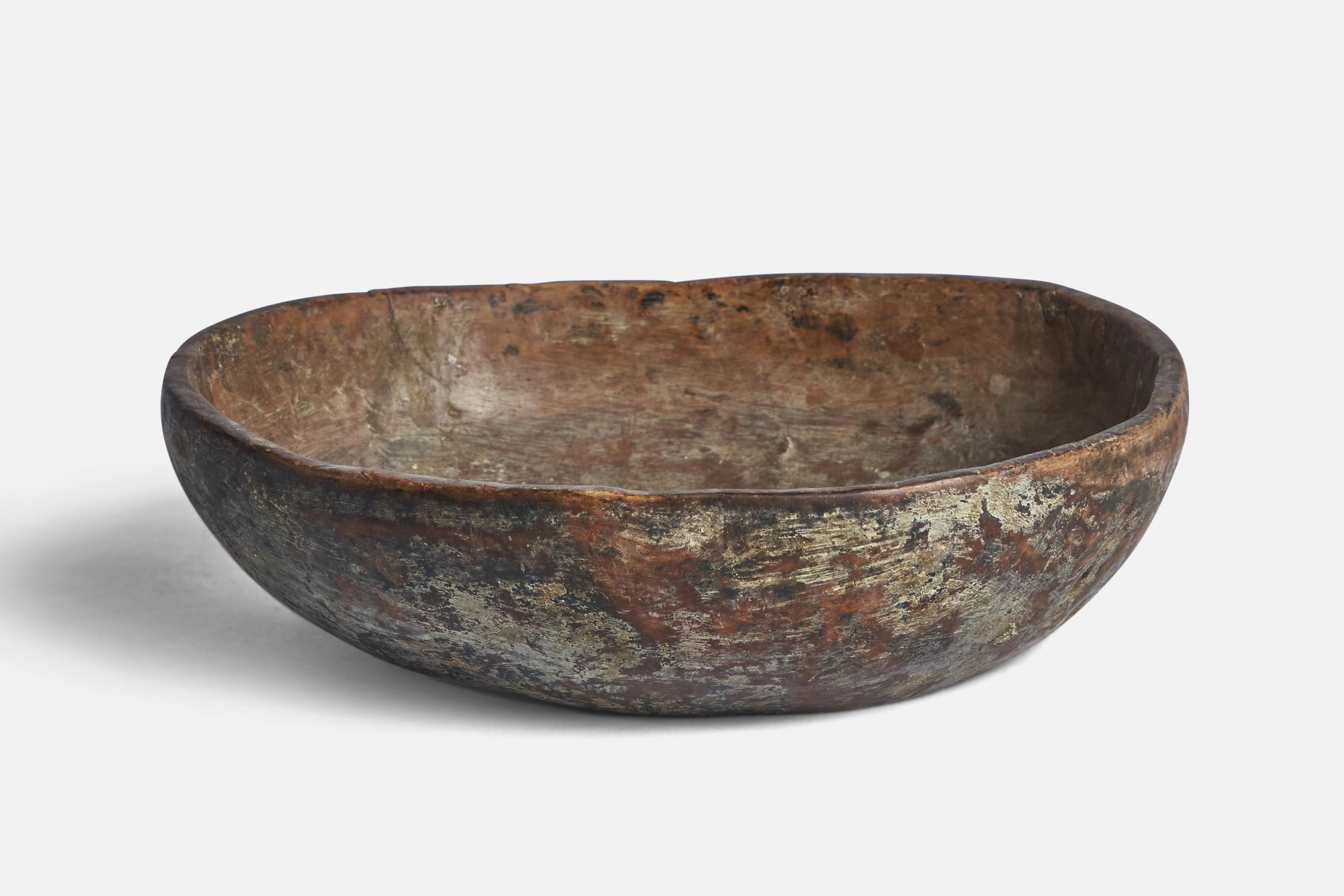 A wood bowl produced in Sweden, 19th century.

“HLHS” inscription on bottom