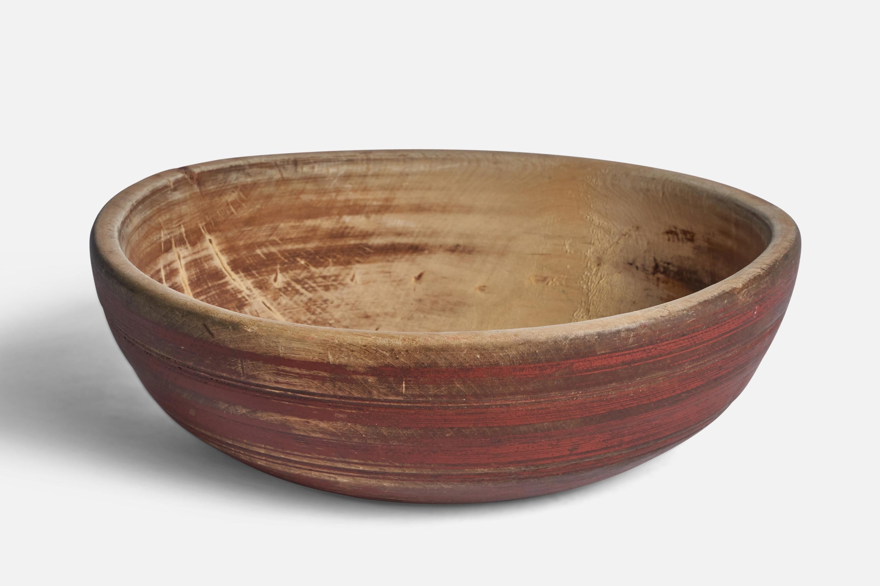 A red-painted wood bowl produced in Sweden, 19th Century