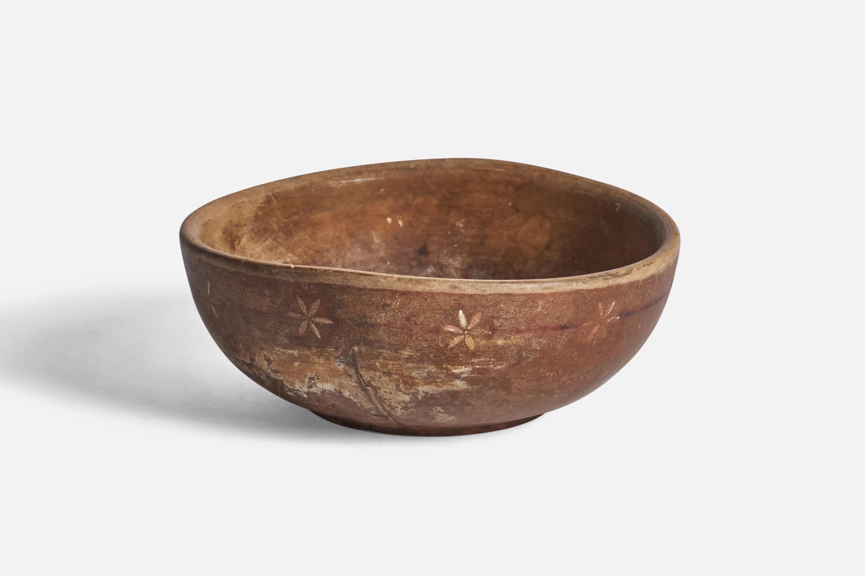 A hand-painted wood bowl produced in Sweden, 19th century.