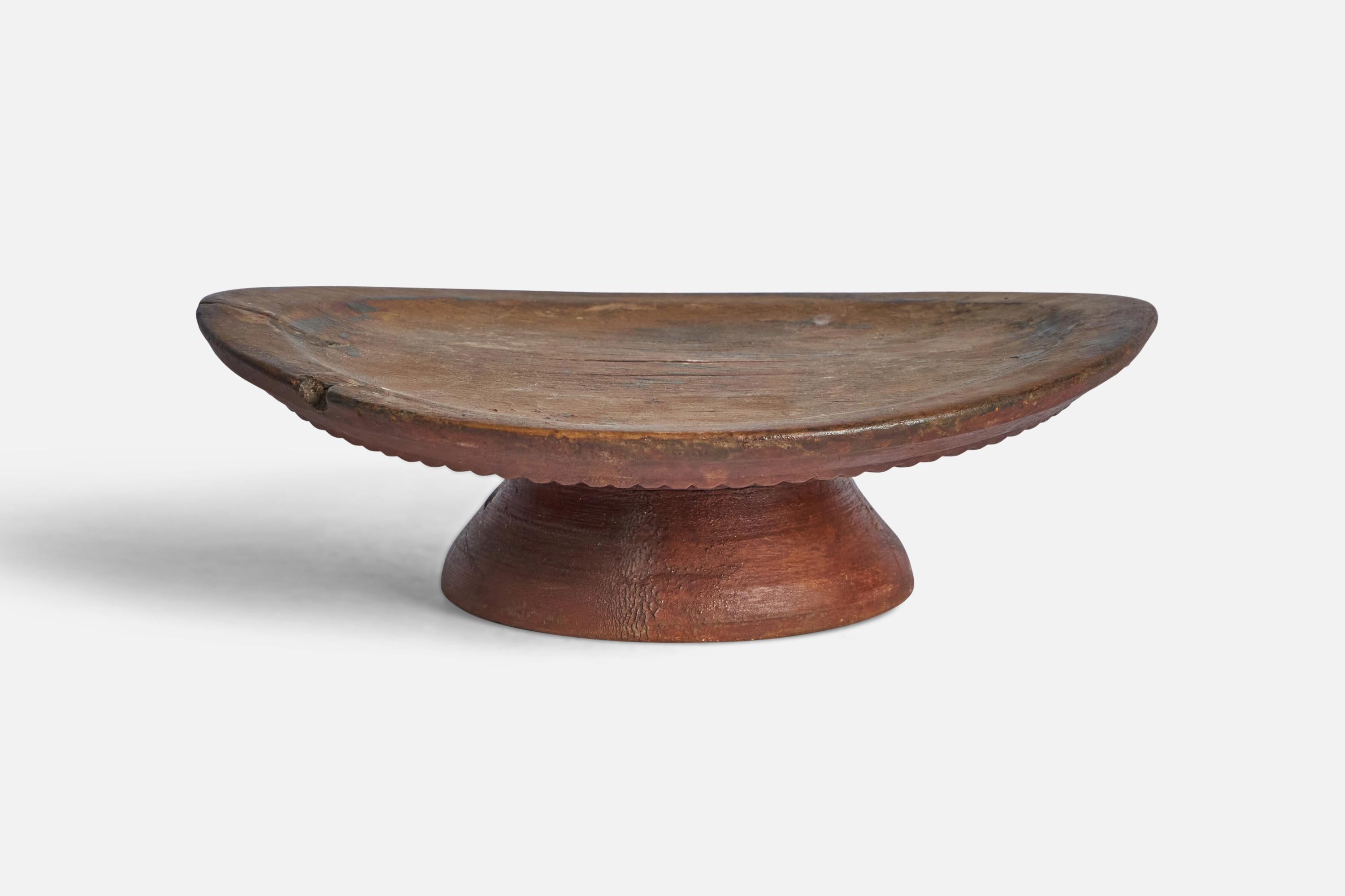 A wood serving dish produced in Sweden, 19th century.

“A” on bottom side
