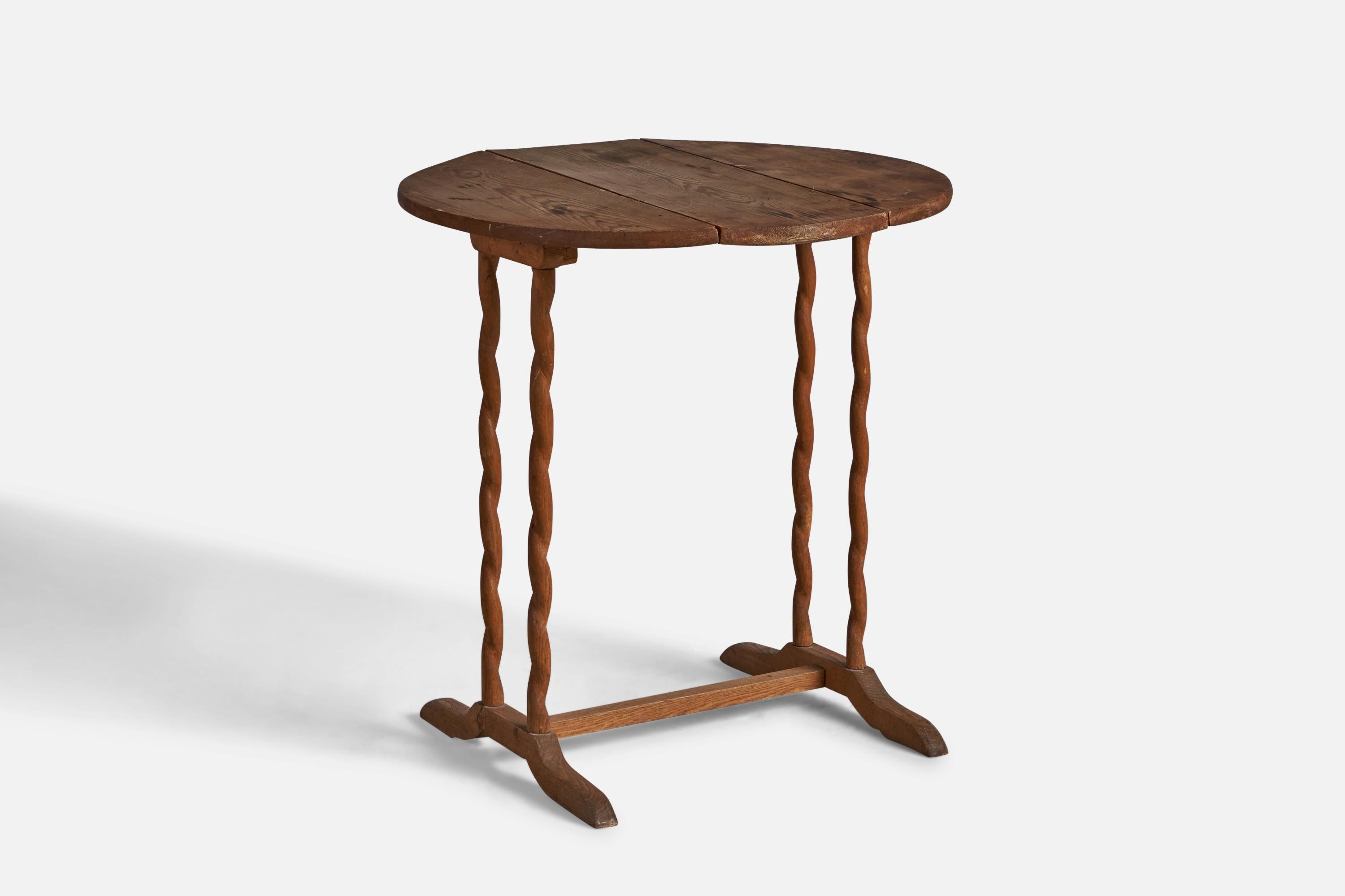 An adjustable pine end table, designed and produced in Sweden, c. 1900.