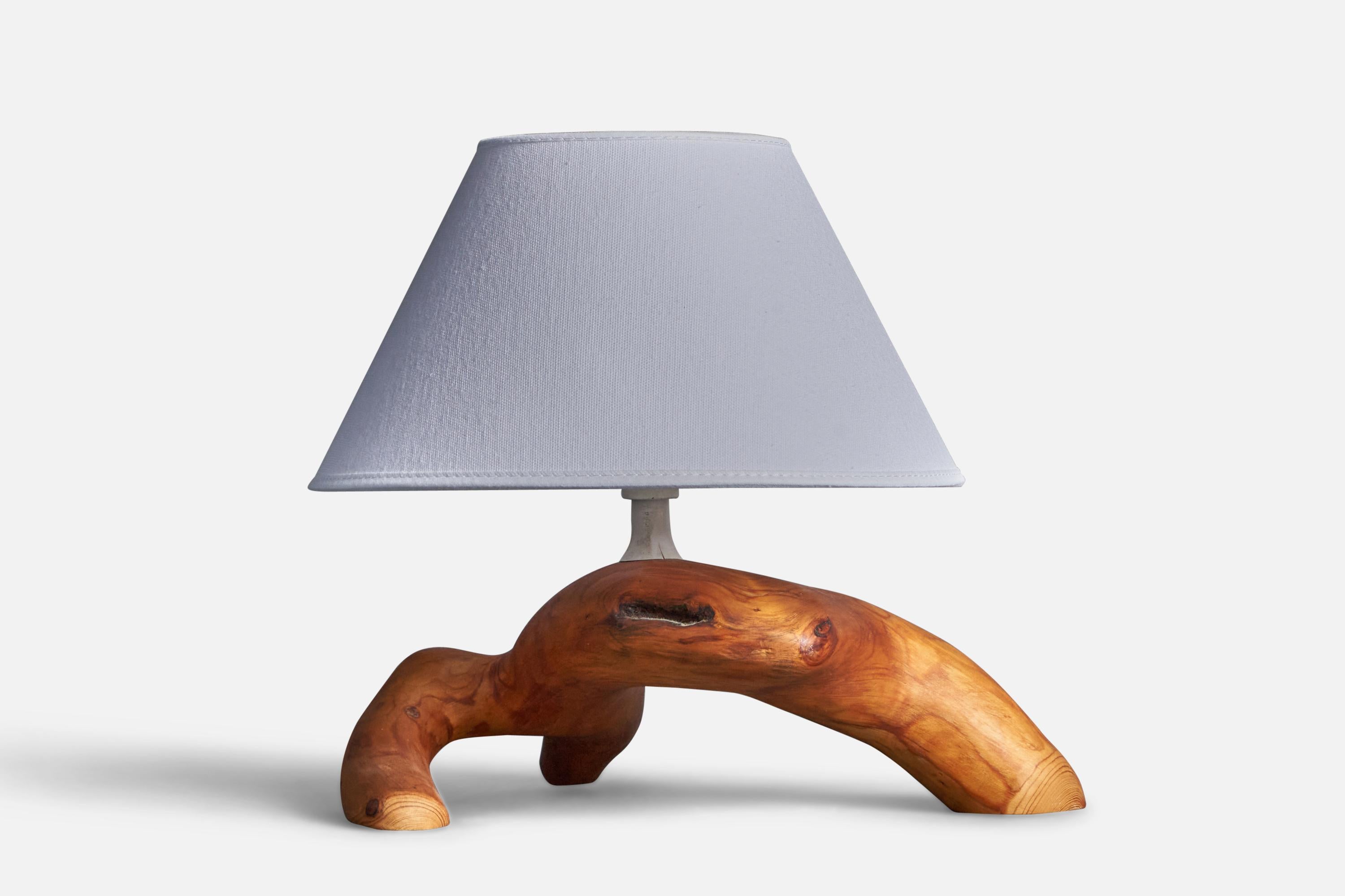 A handcrafted free form table lamp. In solid pine burl / driftwood.

 Dimensions of Lamp (inches): 7.5” H x 11.75” W x 9.5” D

Dimensions of Shade (inches): 4.5” Top Diameter x 10” Bottom Diameter x 6” H

Dimensions of Lamp with Shade (inches):