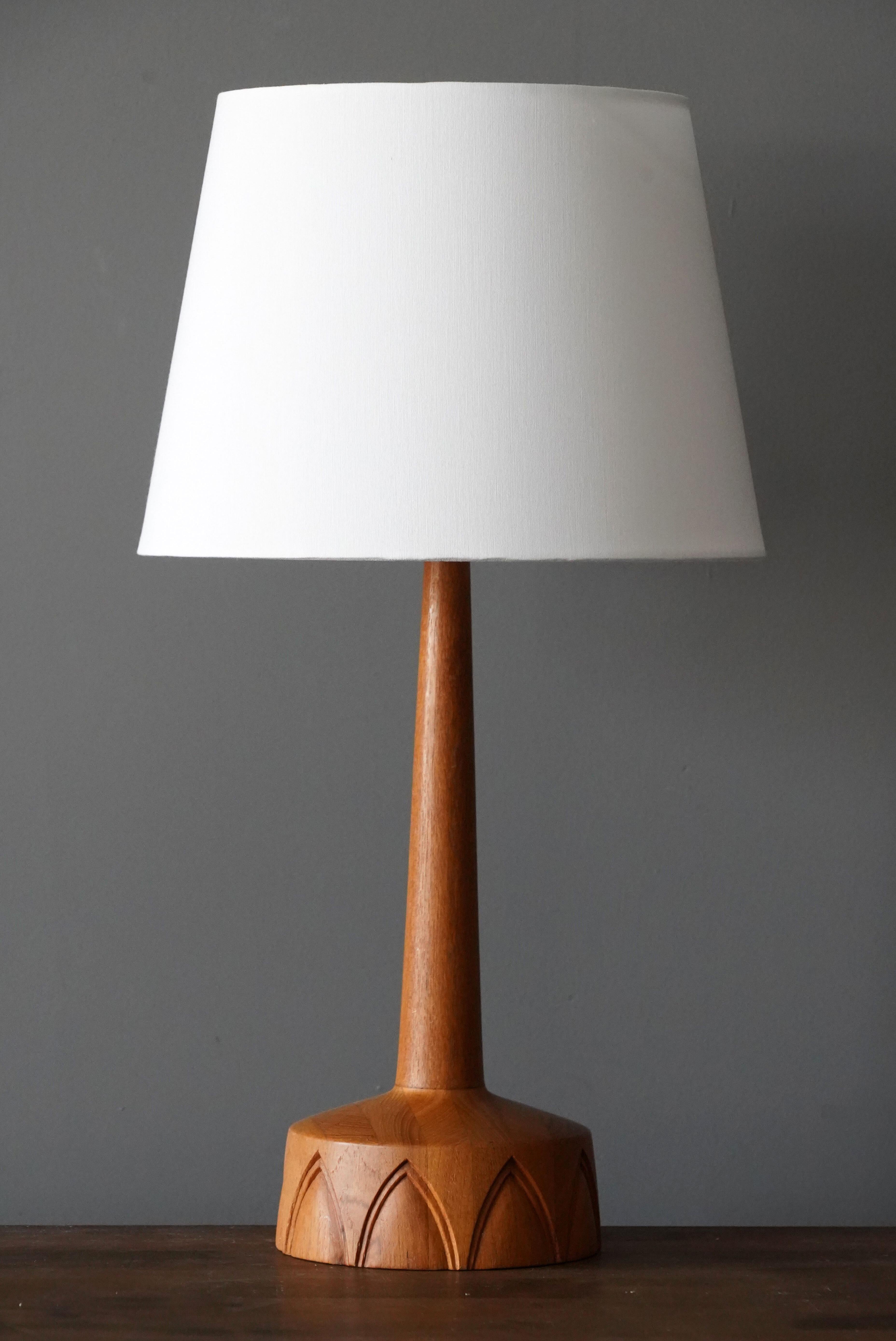 A finely sculpted teak table lamp. Produced in Sweden, 1960s. 

Sold without lampshade. Dimensions without lampshades.

Other designers of the period include Hans Agne Jacobsen, Josef Frank, Palshus, Kaare Klint, and Hans Bergström.