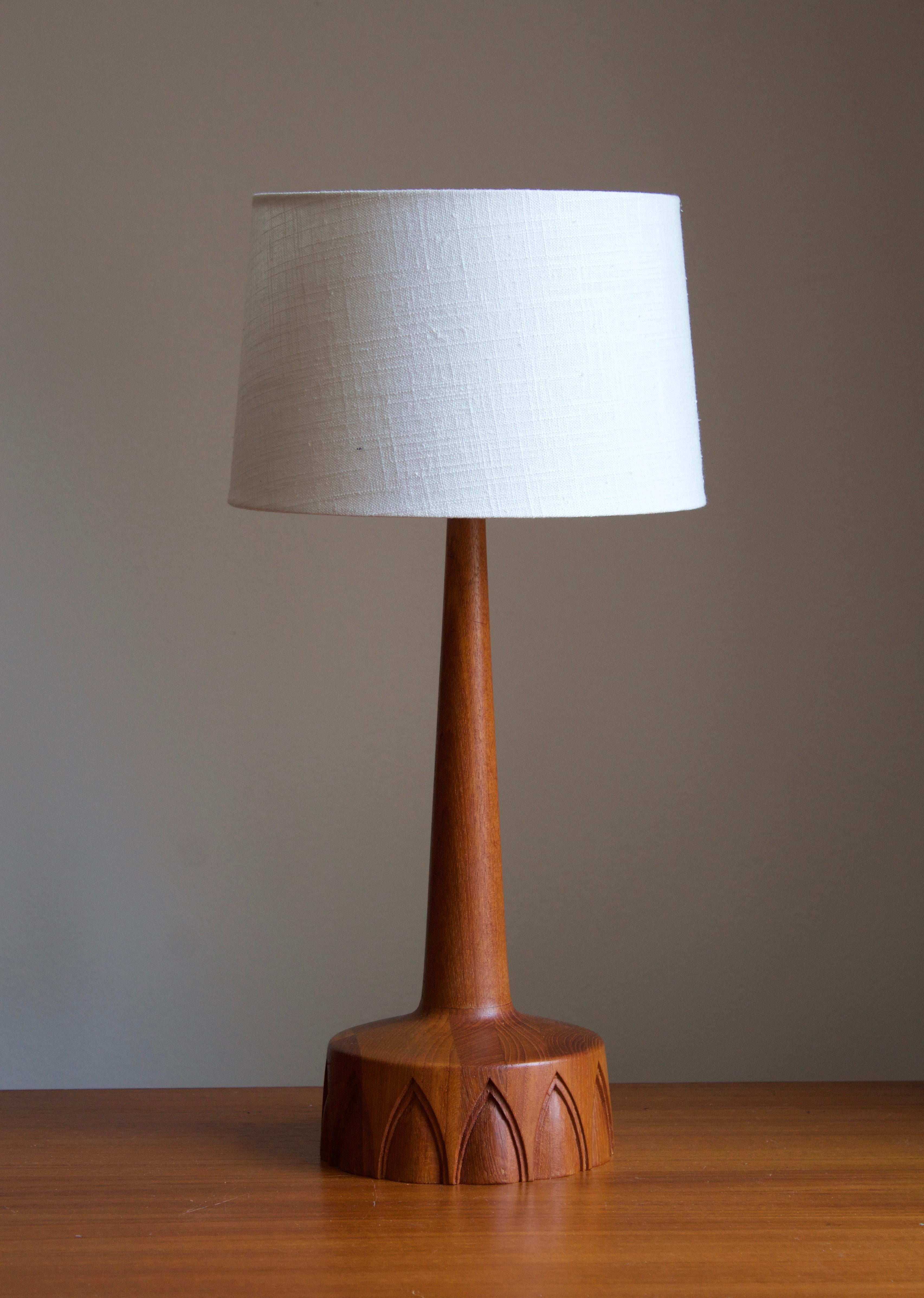 A finely sculpted teak table lamp. Produced in Sweden, 1960s. 

Sold without lampshade. Dimensions without lampshades. Height includes socket.

Other designers of the period include Hans Agne Jacobsen, Josef Frank, Palshus, Kaare Klint, and Hans