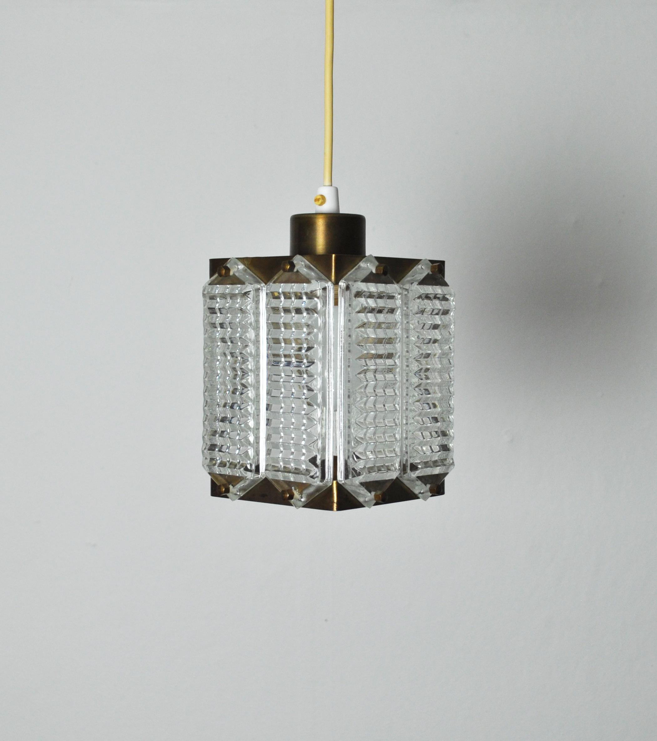 Wiktor Berndt brass and Swedish crystal ceiling light for Flygsfors, 1950s-1960s.
Fine vintage condition with patination.
Wiktor Berndt was chief designer of Flygsfors from 1956-1974.
