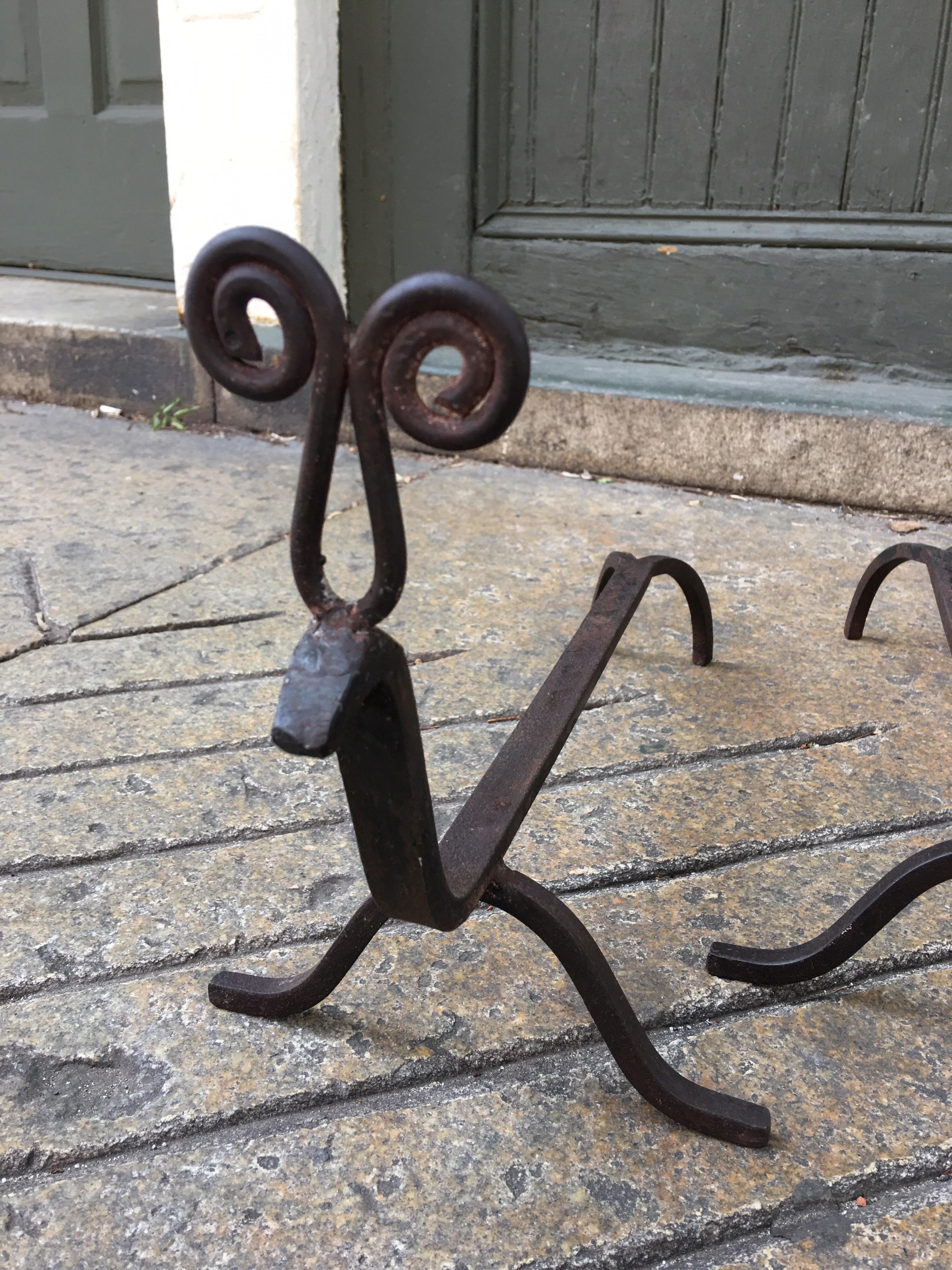 Whimsical pair of Swedish Rain Deer Andirons. Handwrought with curly antlers.