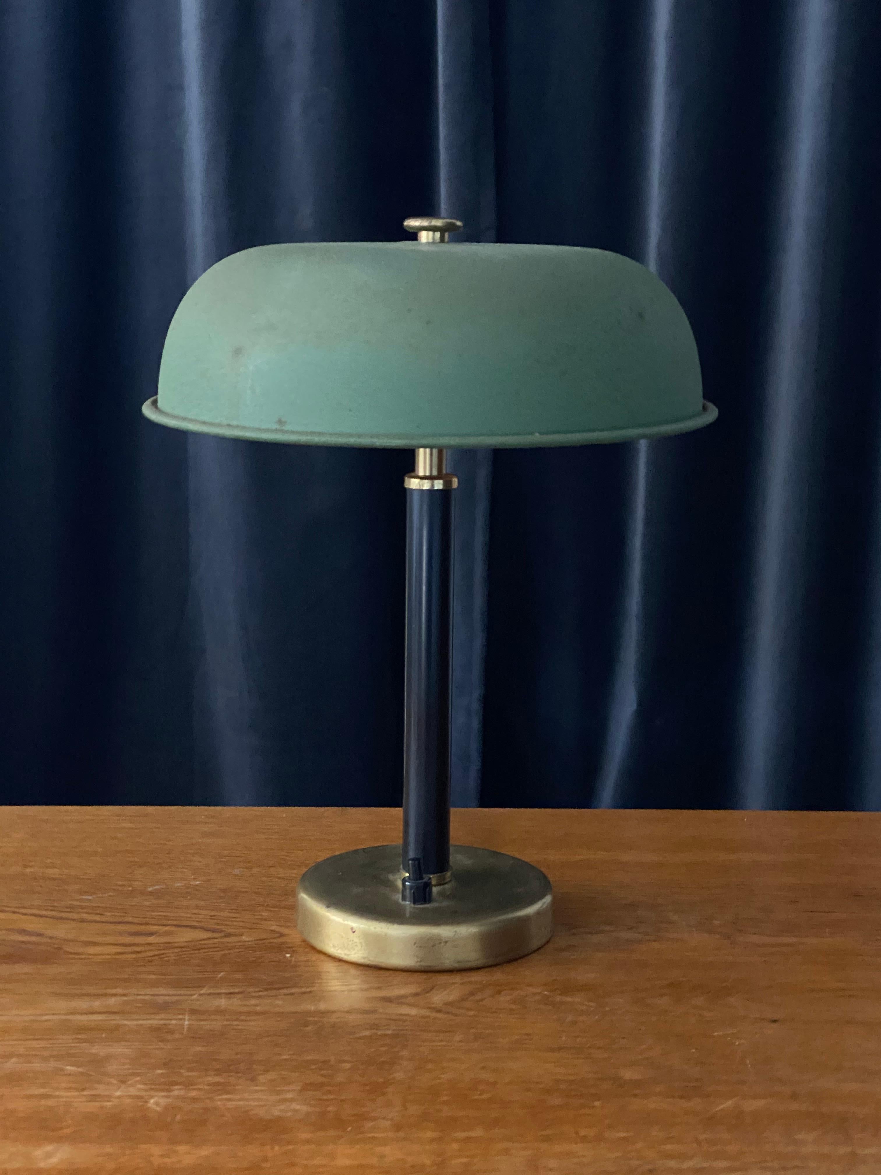 A small modernist table lamp. In brass and black painted wood, green lacquered metal. Produced in Sweden, late 1940s.

Other designers of the period include Paavo Tynell, Lisa Johansson-Pape, Carl-Axel Acking, and Gunnar Asplund.
