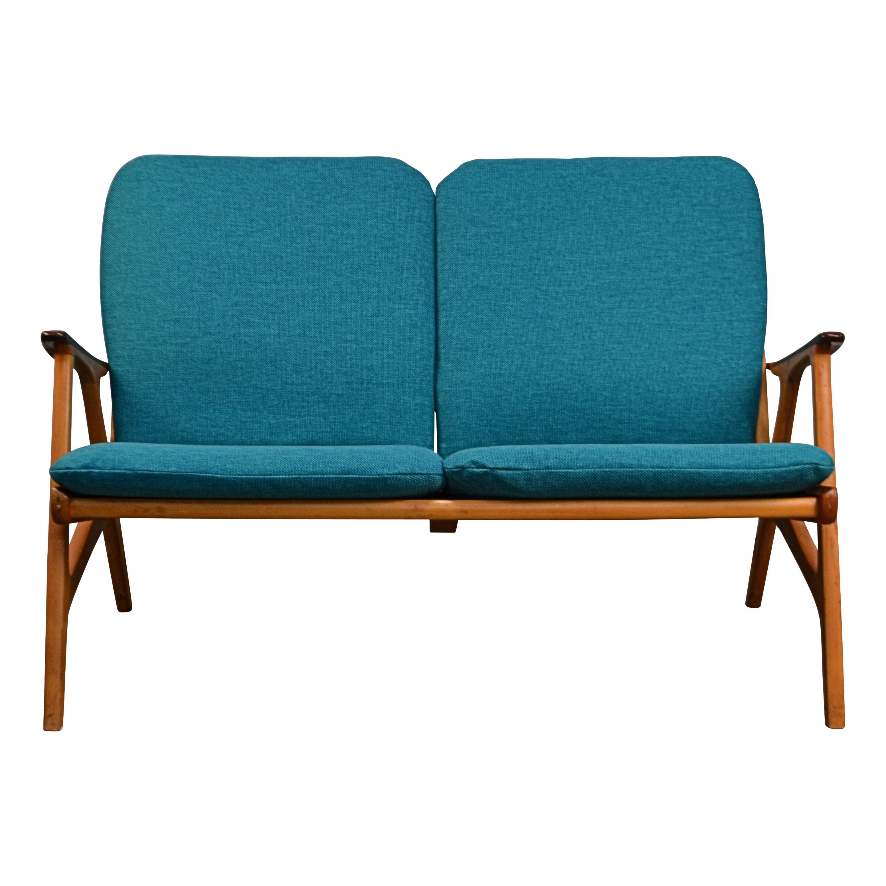 Vintage Swedish two-seater sofa and lounge chair designed by Svegard Markaryd. This teak and birch Mid-century modern seating group features a typical sixties design, new webbing to ensure many more years of seating comfort, and new blue/green