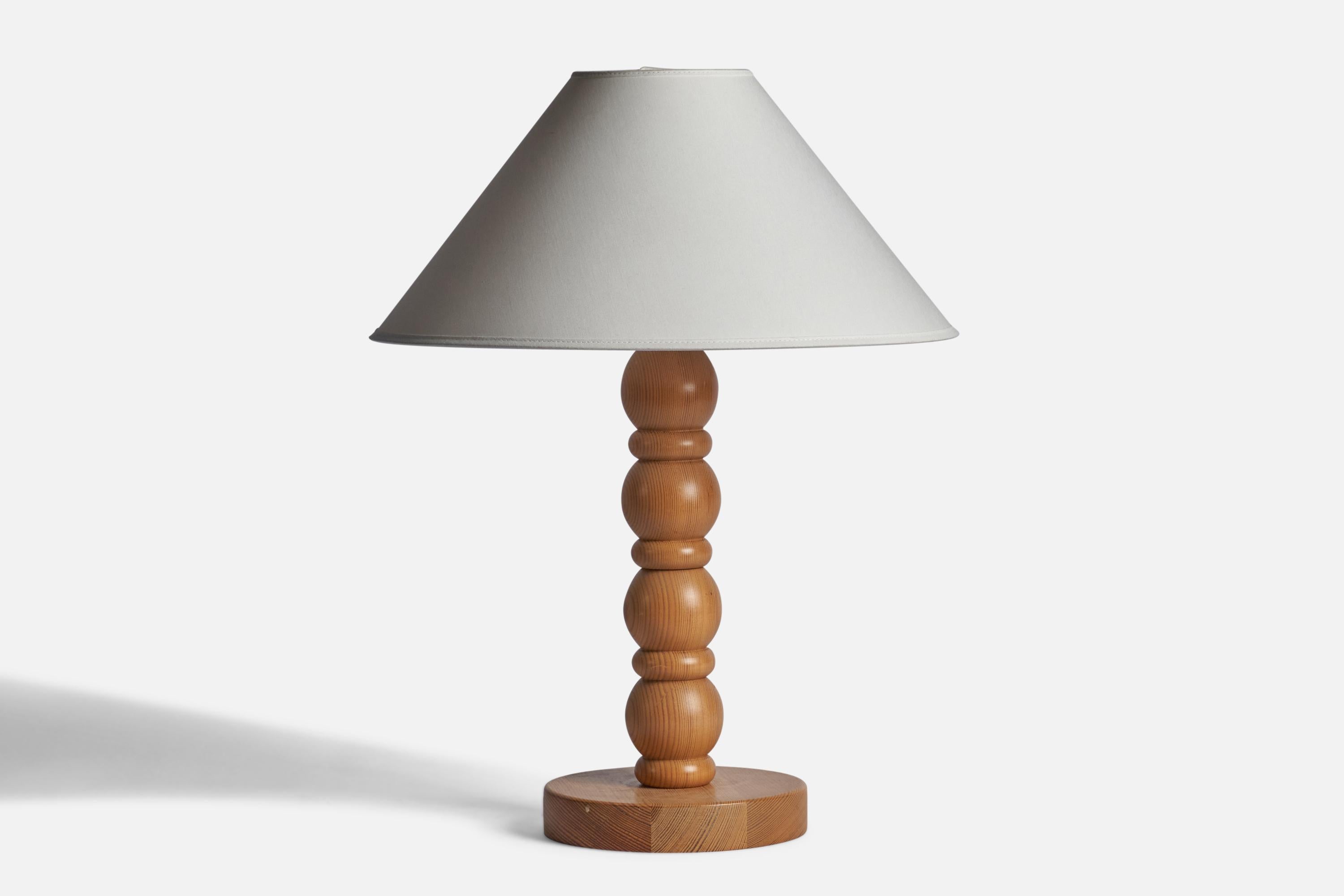 A pine table lamp designed and produced in Sweden, 1970s.

Dimensions of Lamp (inches): 15.75” H x 7” Diameter
Dimensions of Shade (inches): 4.5” Top Diameter x 16” Bottom Diameter x 9” H 
Dimensions of Lamp with Shade (inches): 22” H x 16”