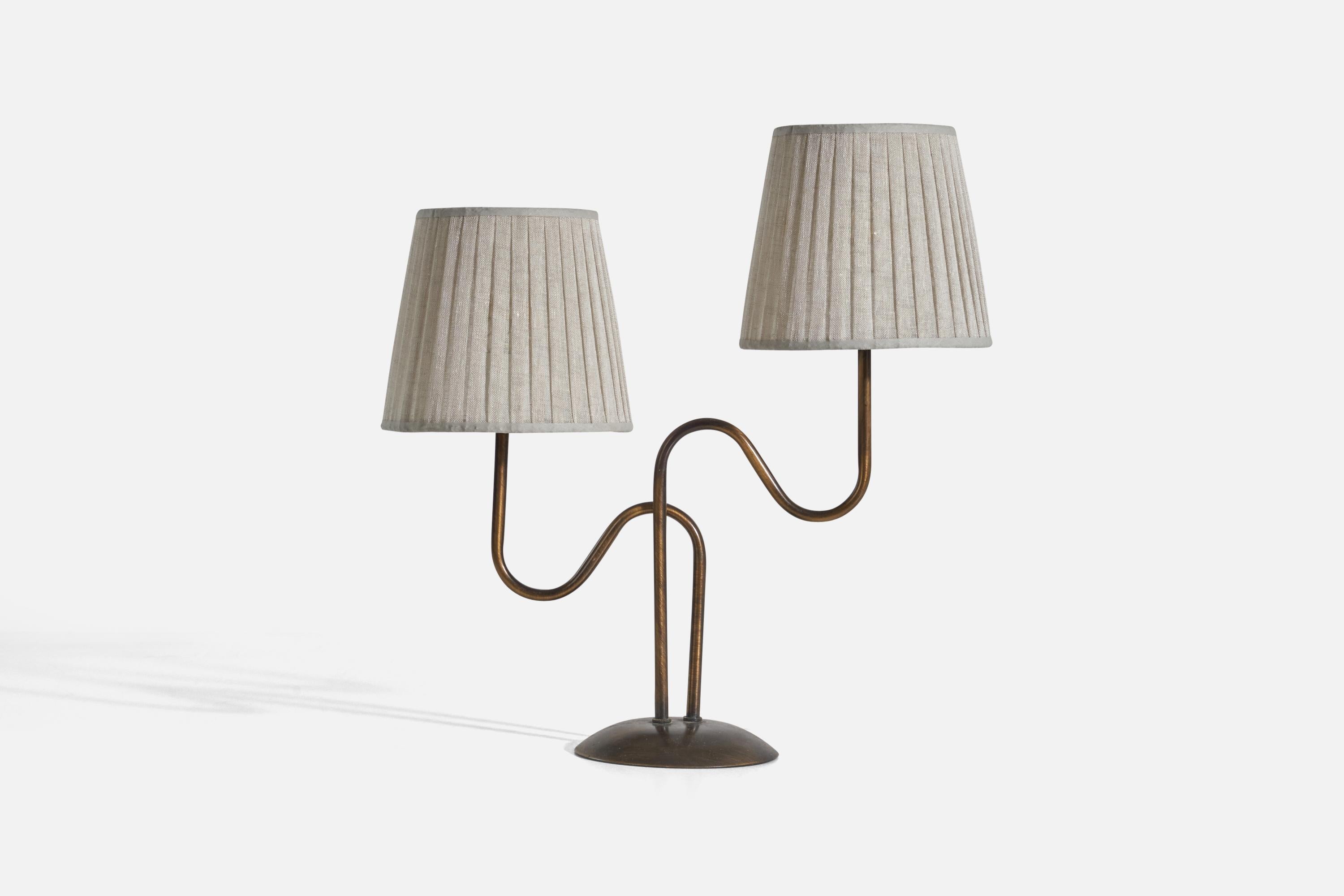A brass and fabric, 2-light table lamp designed and produced in Sweden, c. 1970s-1980s.

Sold with Lampshades. Dimensions stated are of table lamp with Lampshades.

Socket takes E-14 bulb.

There is no maximum wattage stated on the fixture.