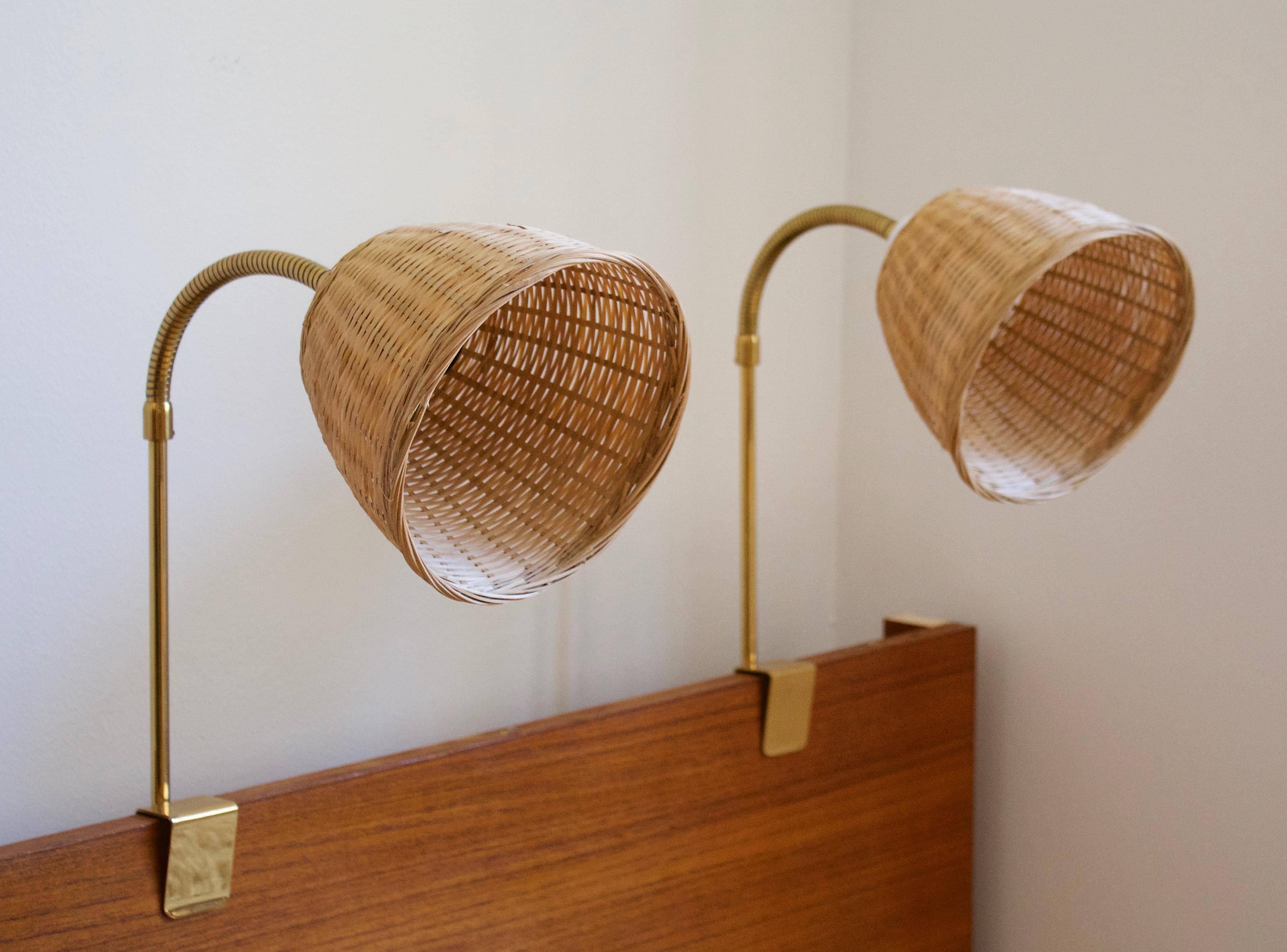 A functionalist bedpost light / task lights, designed and produced in Sweden, c. 1950s-1960s. Features brass, assorted vintage lampshades.

Stated dimensions with lampshade attached. Measurements variable
