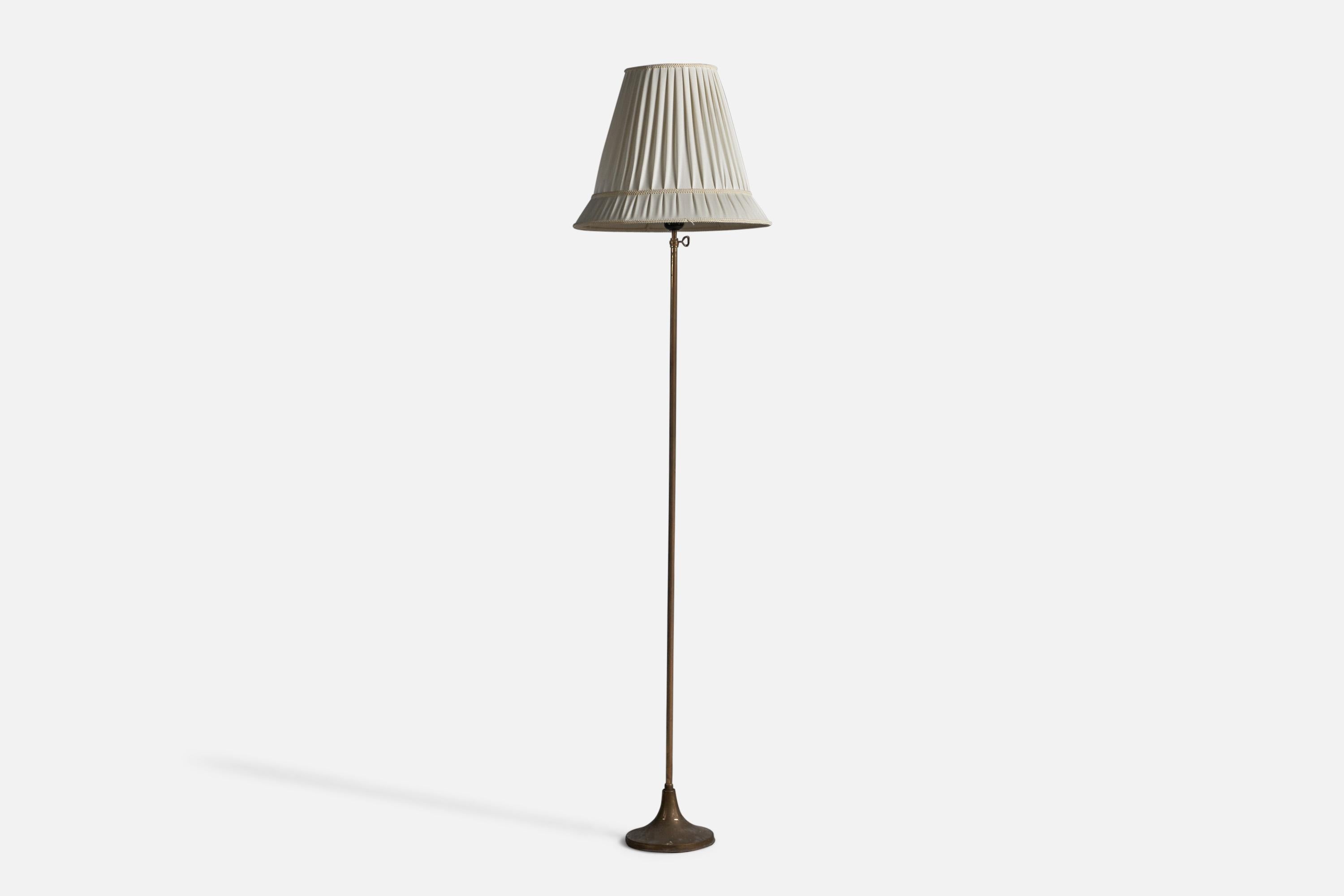 An adjustable brass and fabric floor lamp designed and produced in Sweden, 1930s.

Overall Dimensions (inches): 55.5