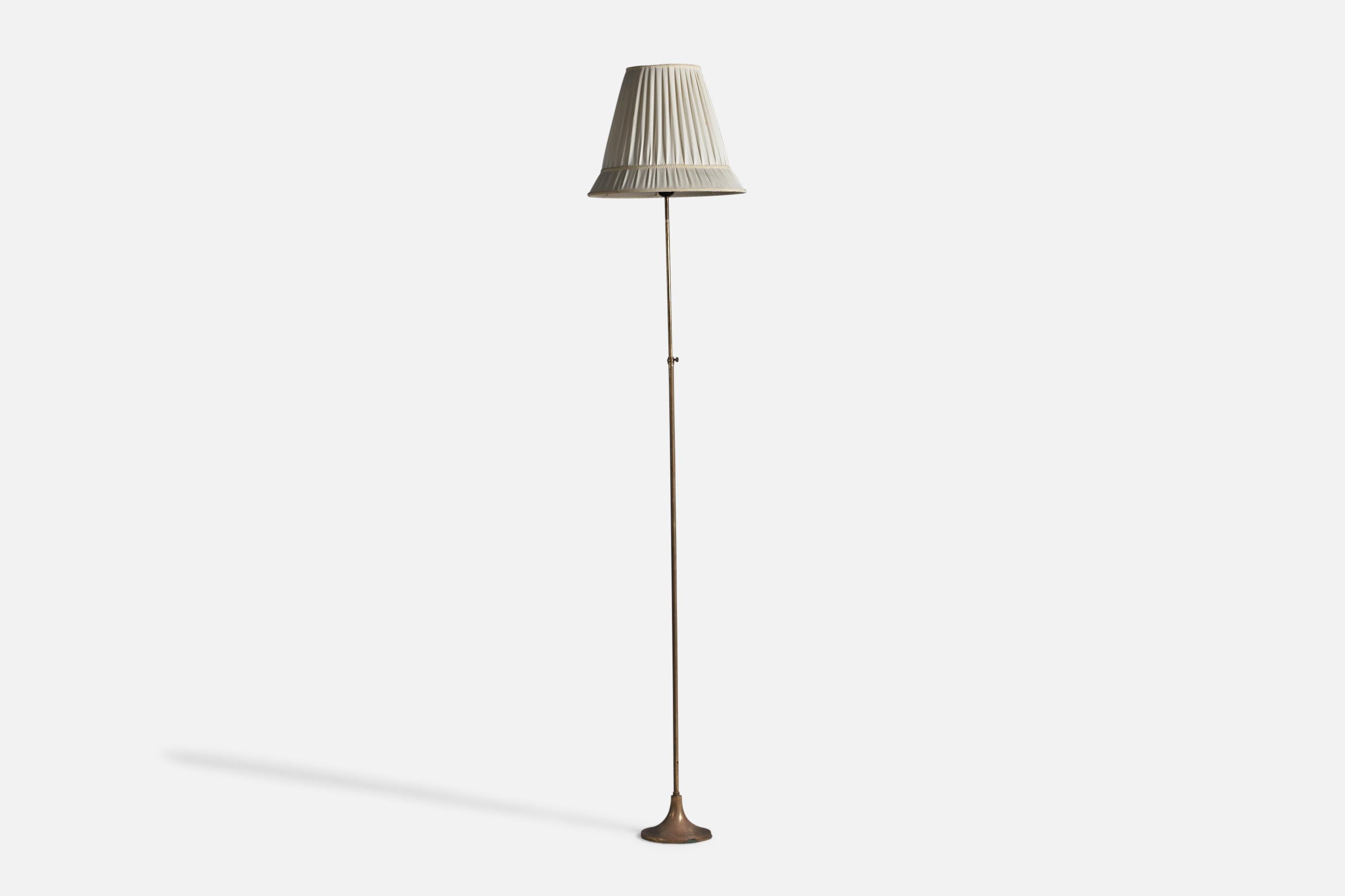 An adjustable brass and fabric floor lamp, designed and produced in Sweden, 1930s.

Overall Dimensions (inches): 69.5