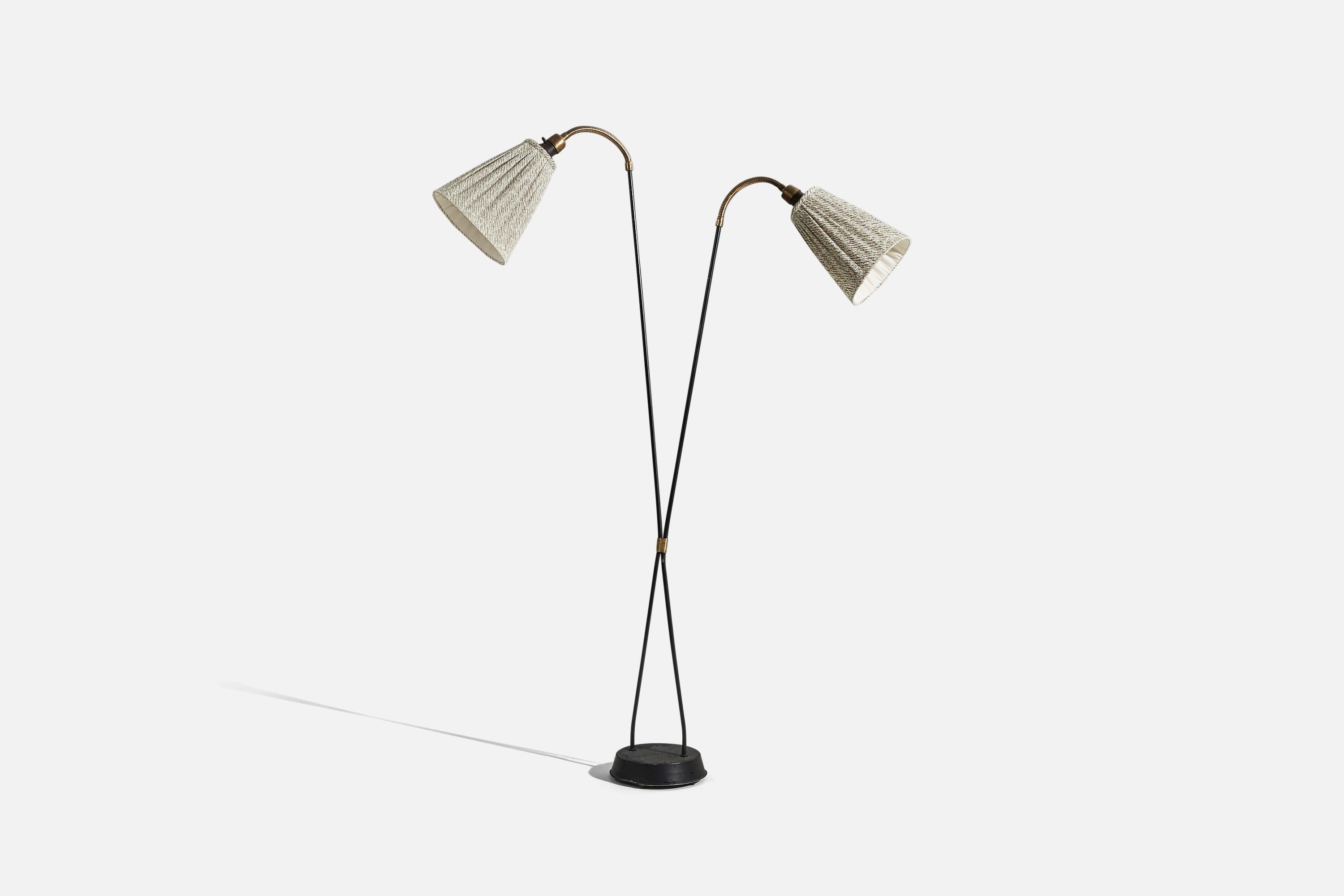 A brass, metal and fabric, adjustable floor lamp, designed and produced in Sweden, c. 1950s. 

Variable dimensions. Dimensions listed refer to the lamp mounted as illustrated in the first image.
 