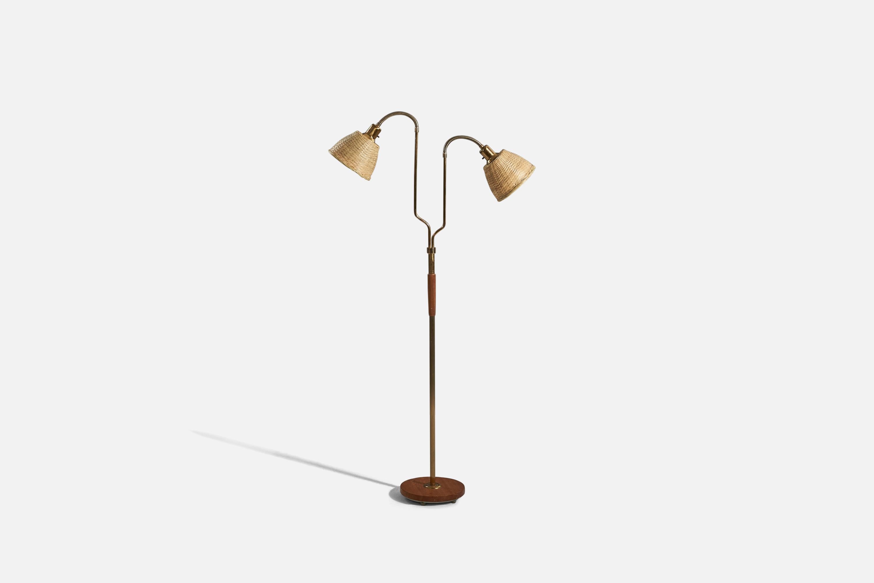 A brass, teak and rattan floor lamp designed and produced by a Swedish designer, Sweden, 1950s. 

Variable dimensions, measured as illustrated in the first image. 
Sold with lampshades. 
Stated dimensions refer to the floor lamp with the