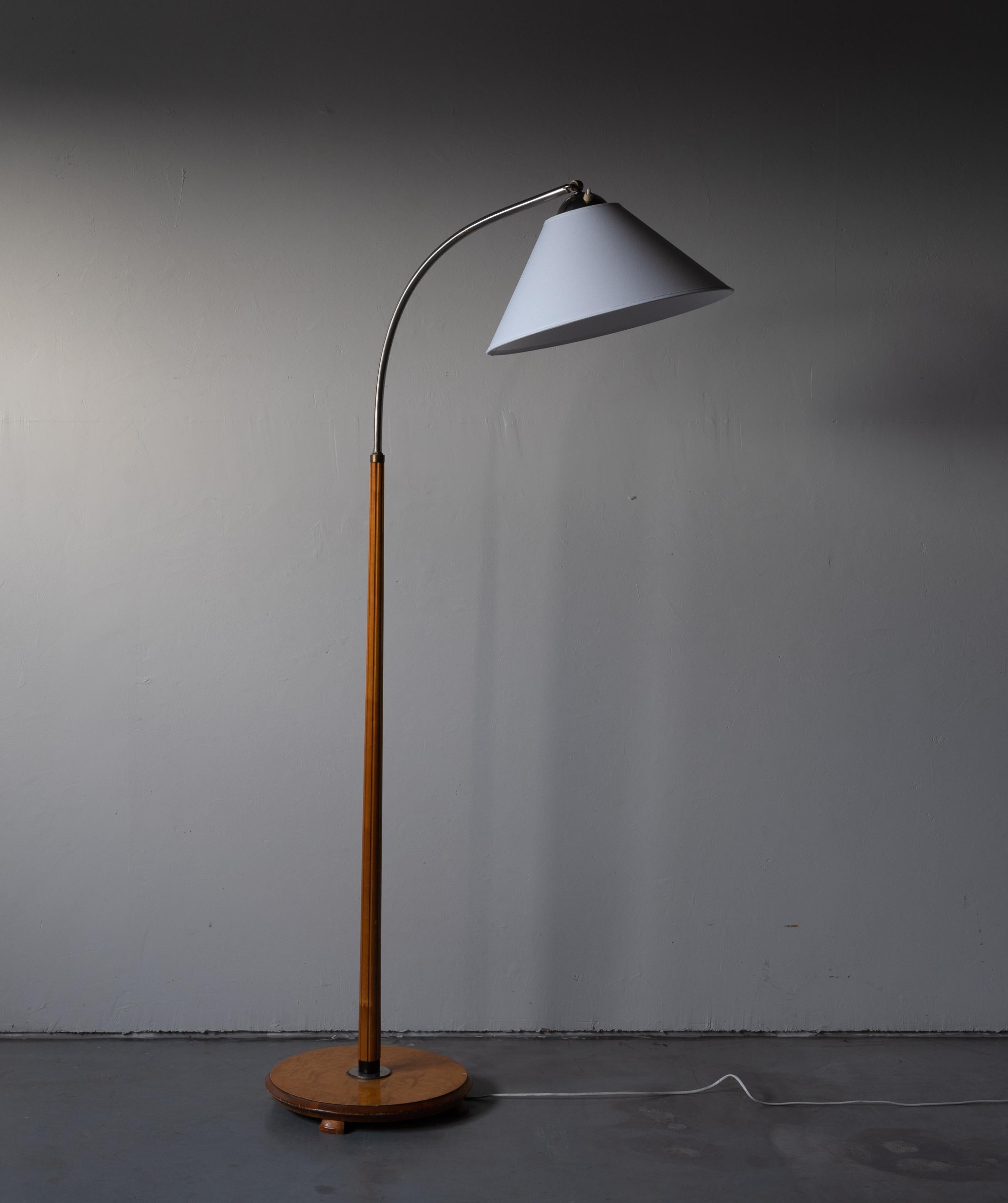 A functionalist floor lamp, designed and produced in Denmark, 1940s. Features brass. Brand new lampshade.

Stated dimensions with lampshade attached as is illustrated in the primary image.