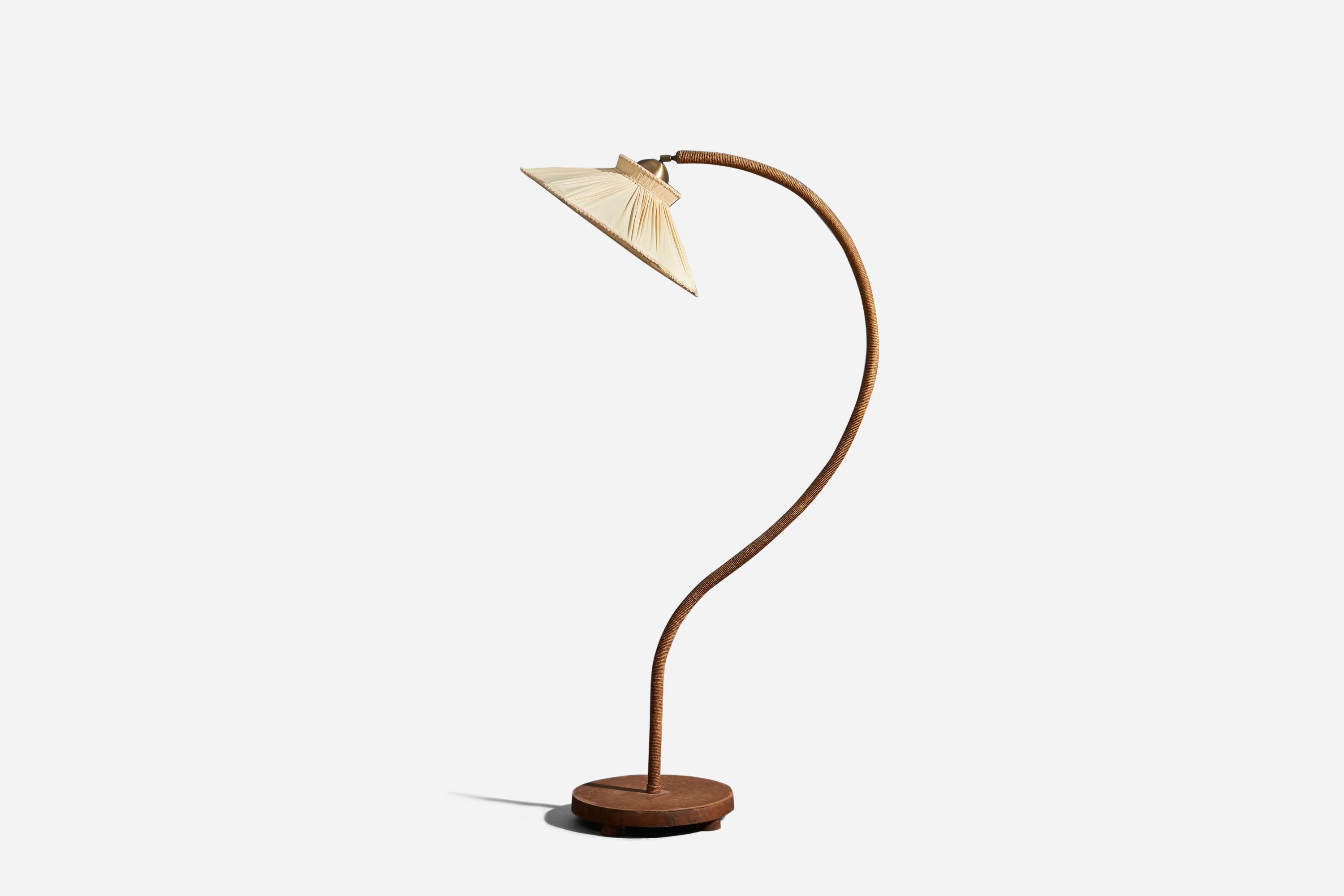 An adjustable, wood, cord and fabric floor lamp designed and produced in Sweden, 1930s.

Dimensions variable, measured as illustrated in first image.

Sold with Lampshade. Dimensions stated are of Floor Lamp with Lampshade. 

Socket takes