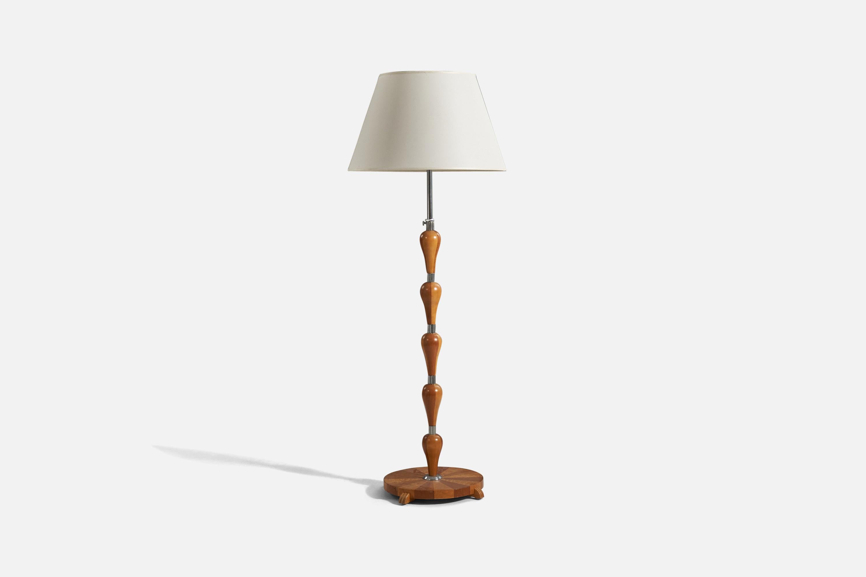 A wood, metal and fabric floor lamp designed and produced in Sweden, 1940s. 

Variable dimensions, measured as illustrated in the first image.
Sold with Lampshade(s). 
Stated dimensions refer to the Floor Lamp with the Shade(s). 

Socket takes