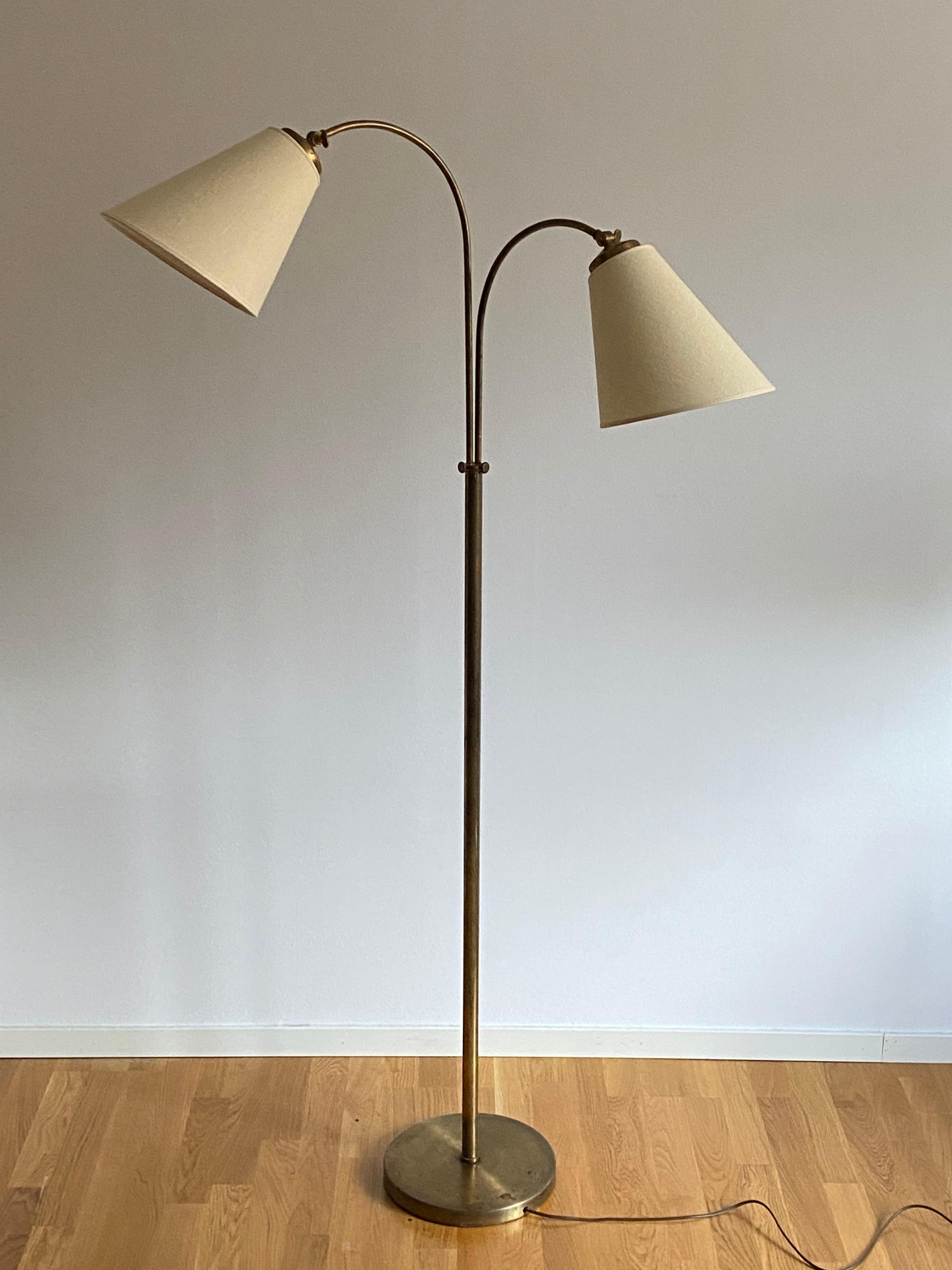 An adjustable two-armed functionalist floor lamp. With adjustable arms. Brand new Swedish made lampshades.

Dimensions variable. 

Other designers of the period include Josef Frank, Paavo Tynell, Hans Agne Jacobsen, and Alvar Aalto.