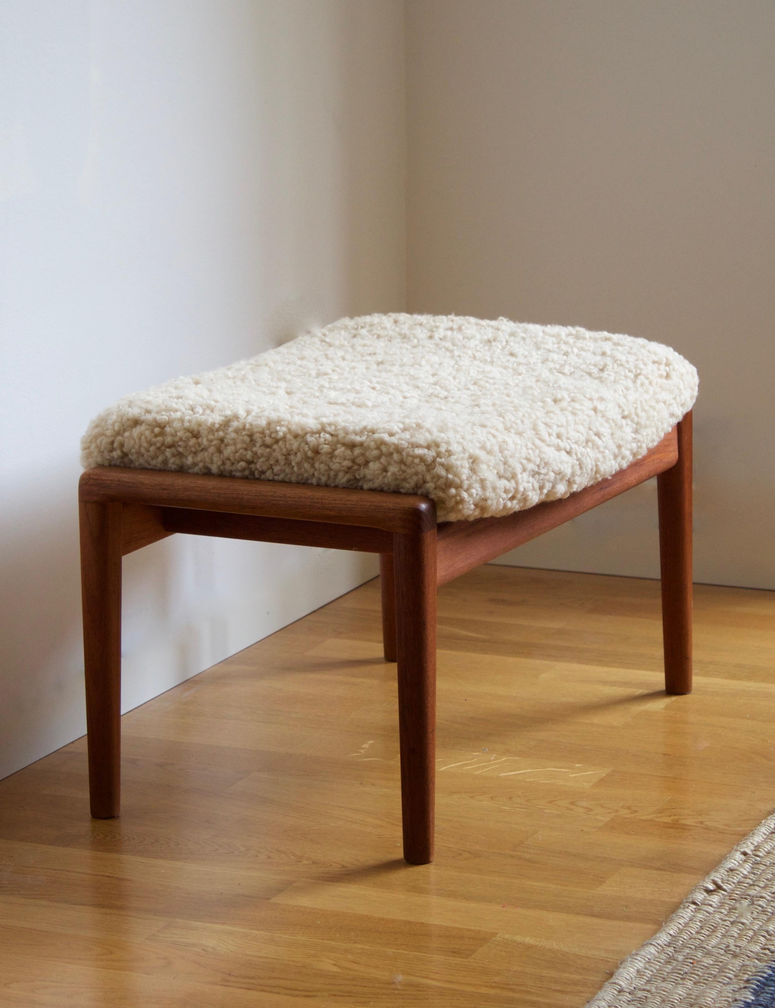 A stool in teak, overstuffed seat reupholstered in brand new sheepskin upholstery. Produced in Sweden, 1950s. Seats position is adjustable and can be tilted.

Other designers of the period include Finn Juhl, Hans Wegner, Isamu Noguchi, Charlotte