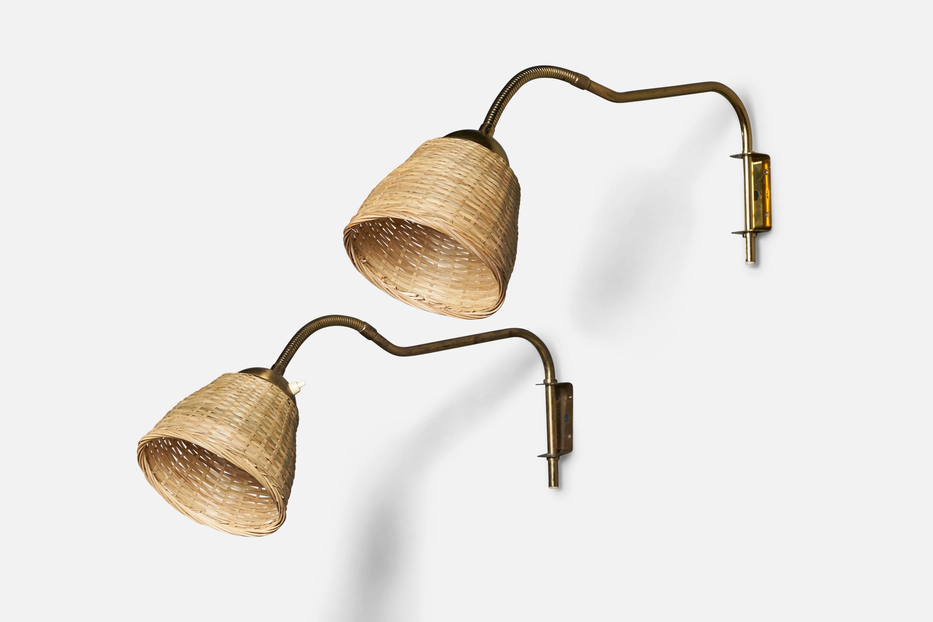 A pair of adjustable brass and rattan wall lights designed and produced in Sweden, 1940s.

Overall Dimensions (inches): 12.5” H x 7” W x 22” D
Back Plate Dimensions (inches): 3.6” H x 1.5” W x 1.5” D
Bulb Specifications: E-26 Bulb
Number of