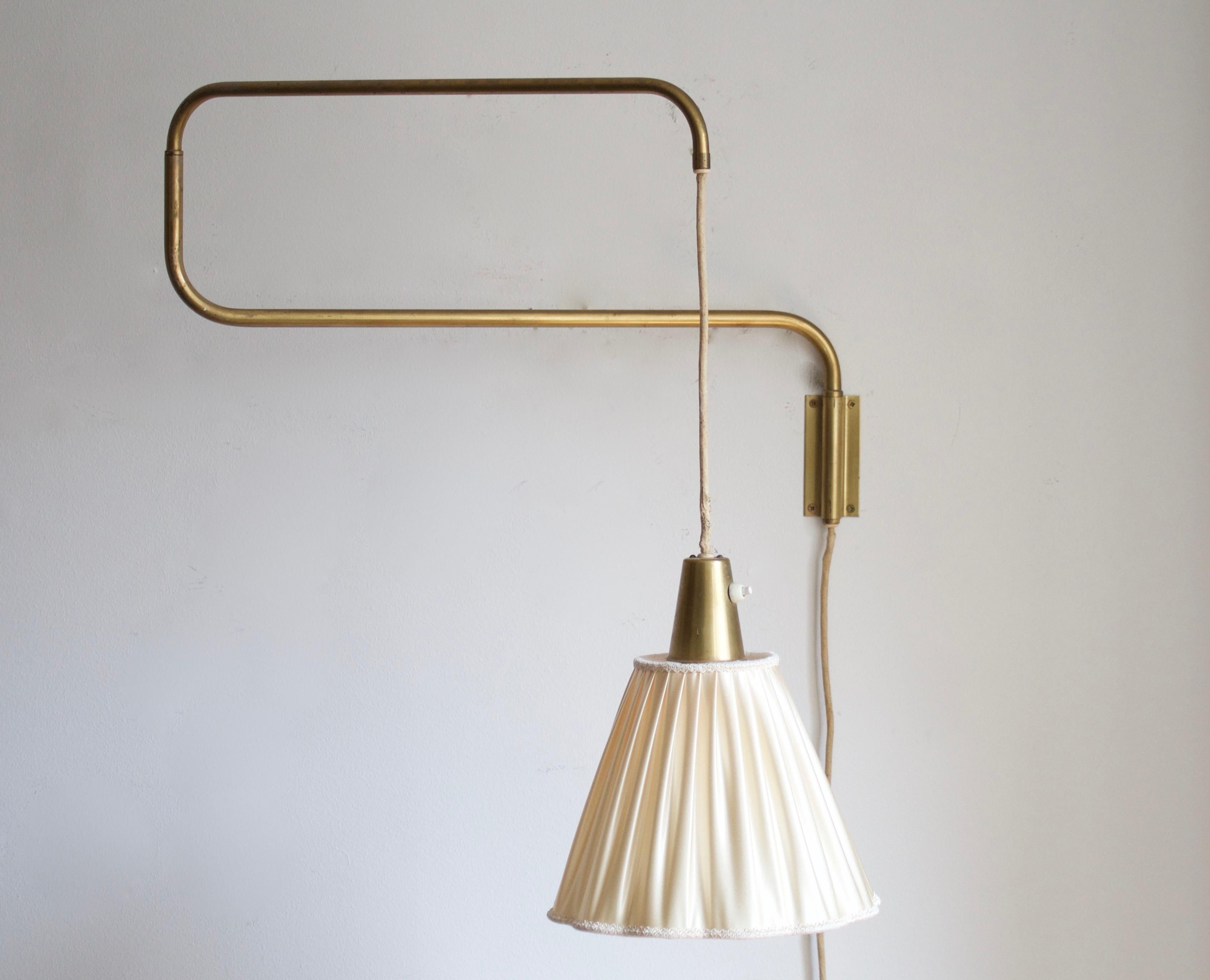 A functionalist wall light / task light, designed and produced in Sweden, 1940s. Features brass. Brand new brass lampshade.

Stated dimensions with lampshade attached as is illustrated in the primary image.

  