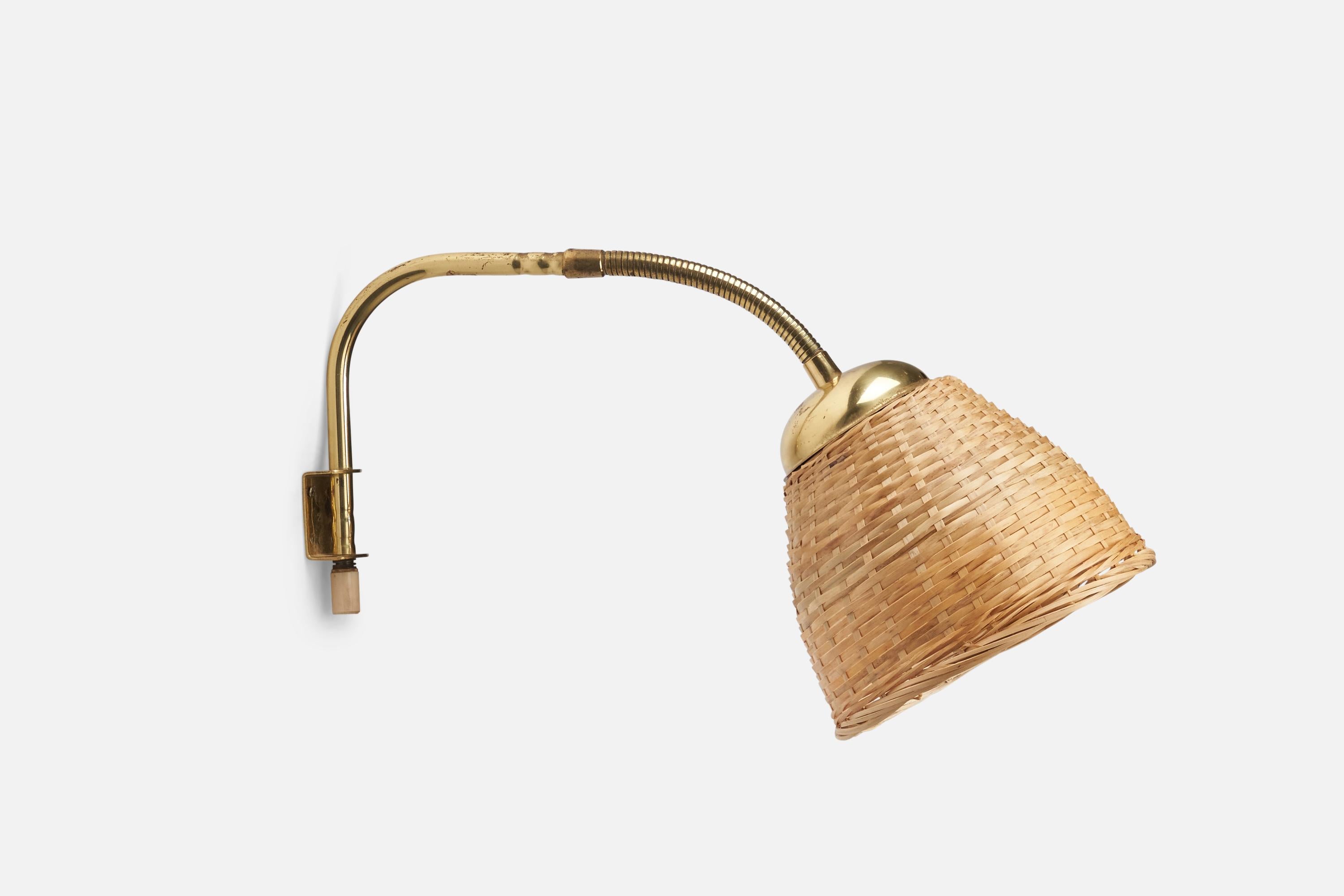 A brass and rattan wall light designed and produced by a Swedish Designer, Sweden, 1940s.

Dimensions of Back Plate (inches) : 1.7 x 1.3 x 0.9 (Height x Width x Depth)

Socket takes standard E-26 medium base bulb.

There is no maximum wattage