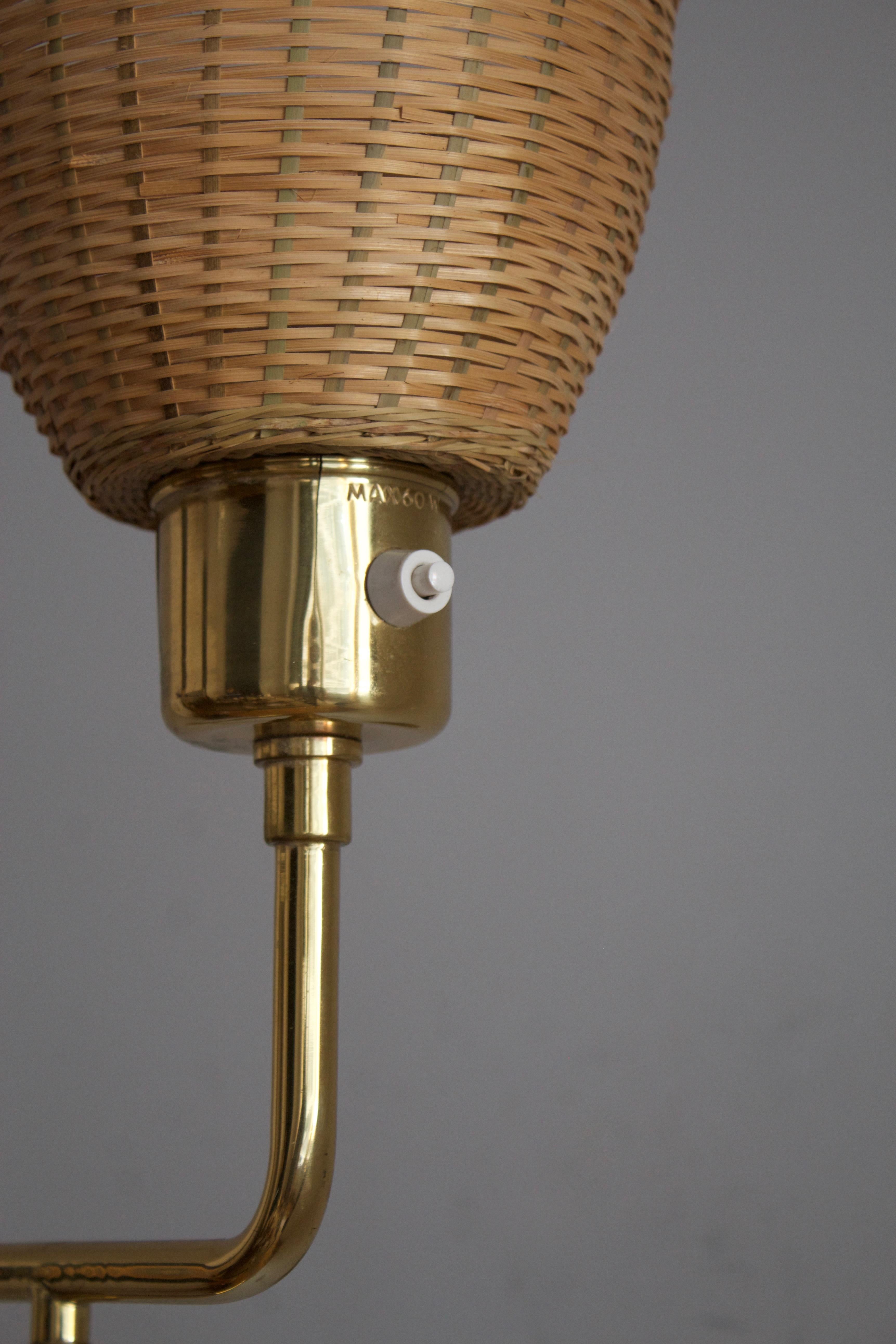 Swedish Designer, Adjustable Wall Light, Brass, Rattan, Sweden, 1970s In Good Condition In High Point, NC