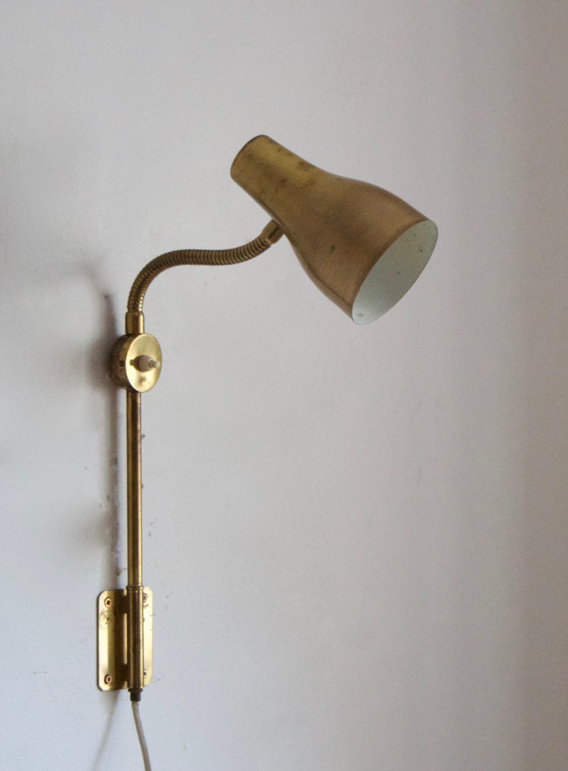 A functionalist wall light / task light, designed and produced in Sweden, 1950s-1960s. Features brass.

Takes one lightbulb on E27 socket. 25W stated max wattage.