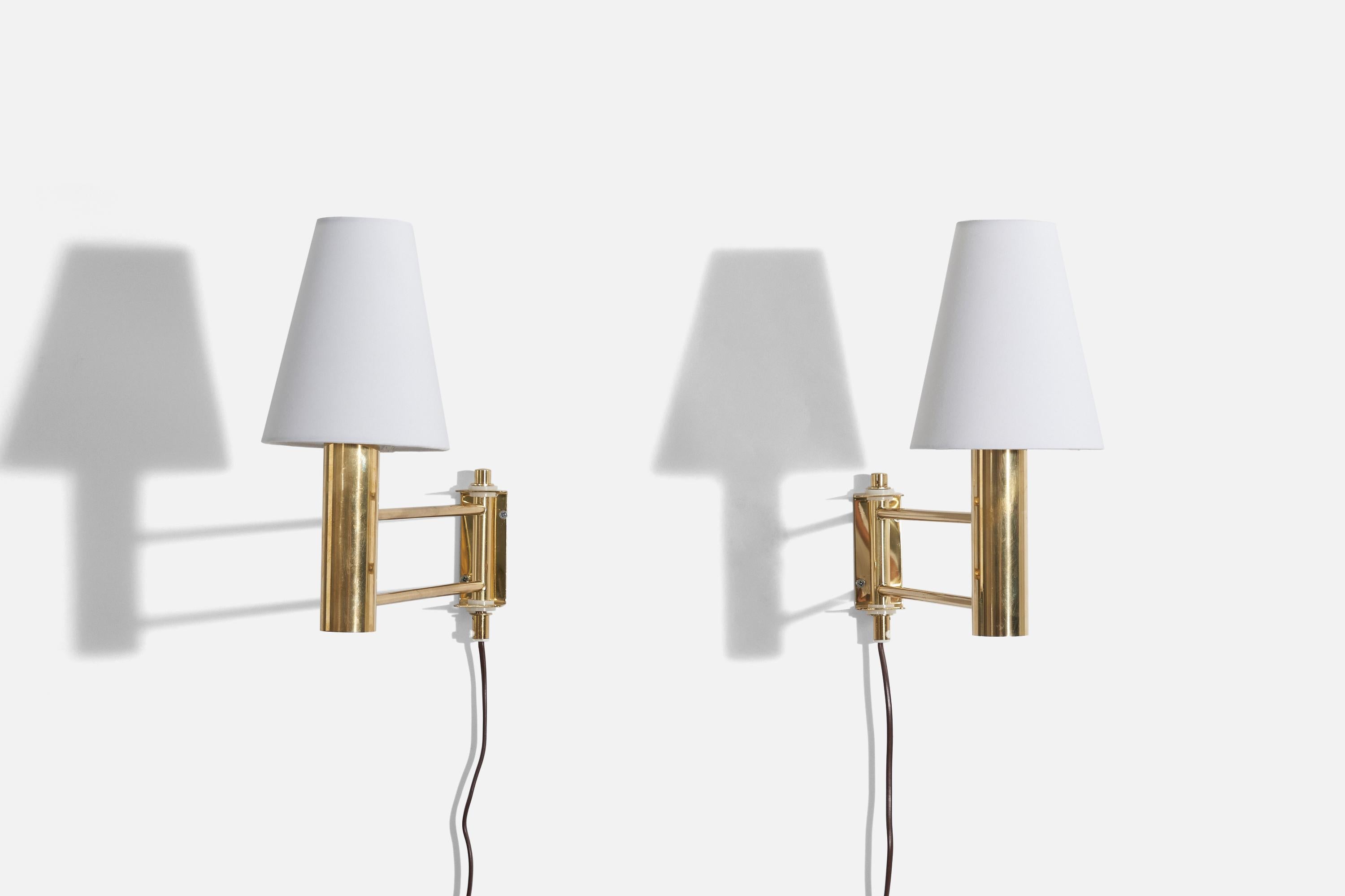 A pair of brass, adjustable wall lights designed and produced in Sweden, c. 1970s. 

Sold with lampshade.
Dimensions of Sconce (inches) : 8 x 1.625 x 13.625 (H x W x D)
Dimensions of Shade (inches) : 2.875 x 5.5 x 6.75 (T x B x H)
Dimensions of