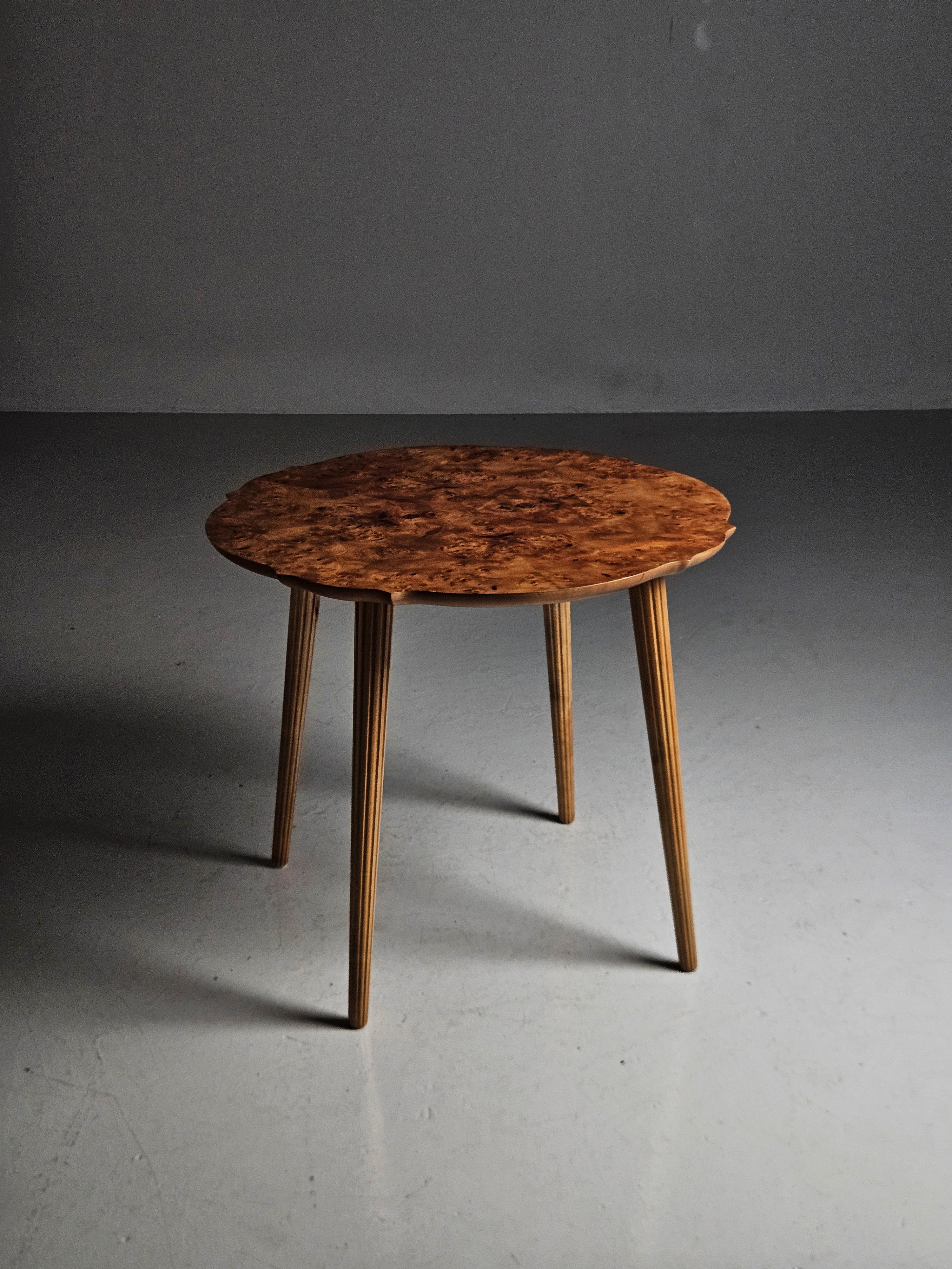Small and elegant coffee or side table made by unknown Swedish designer in the 1940s. 

Alder root table top with four slender legs. 