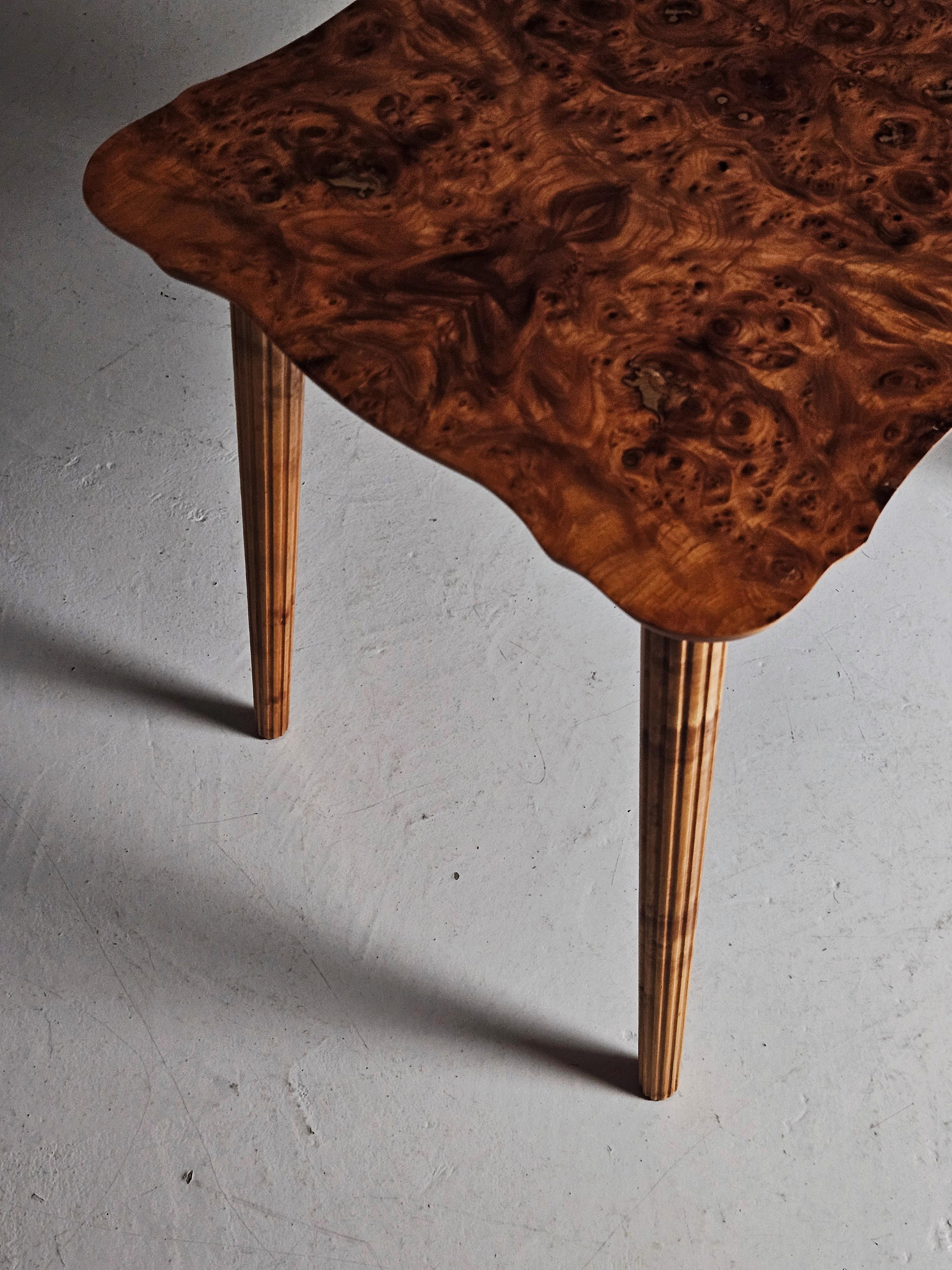 Lovely side table by unknown designer and cabinetmaker. Made in Sweden during the 1940s.

Top of alder root with legs in beech. 