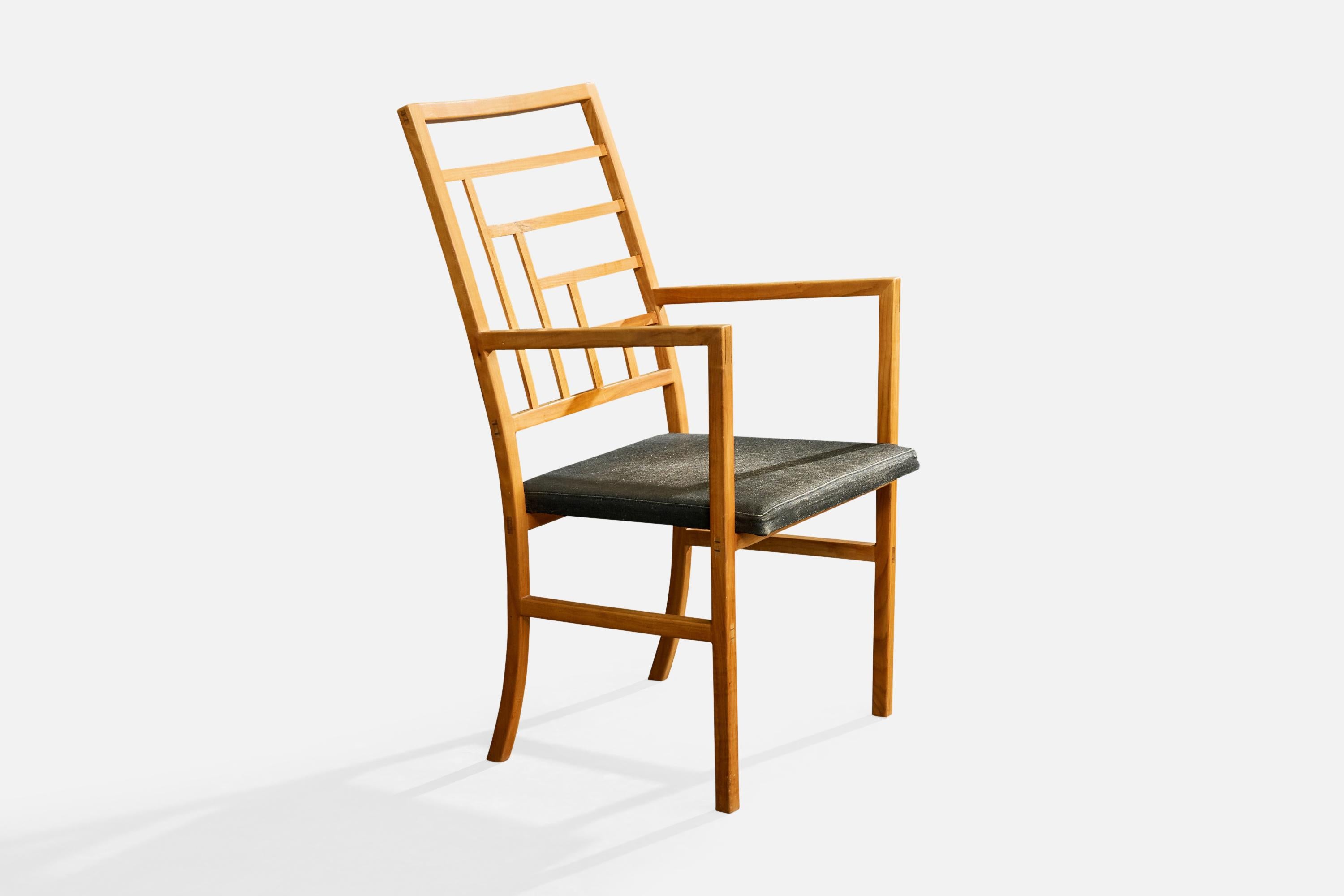 A wood and grey fabric armchair likely designed and produced in Sweden, c. 1960s.

Seat cushion moderately worn.

Wood frame has very minor scuffs and scratches from normal use.

Two repairs as illustrated.

Overall Dimensions (inches): 40.0