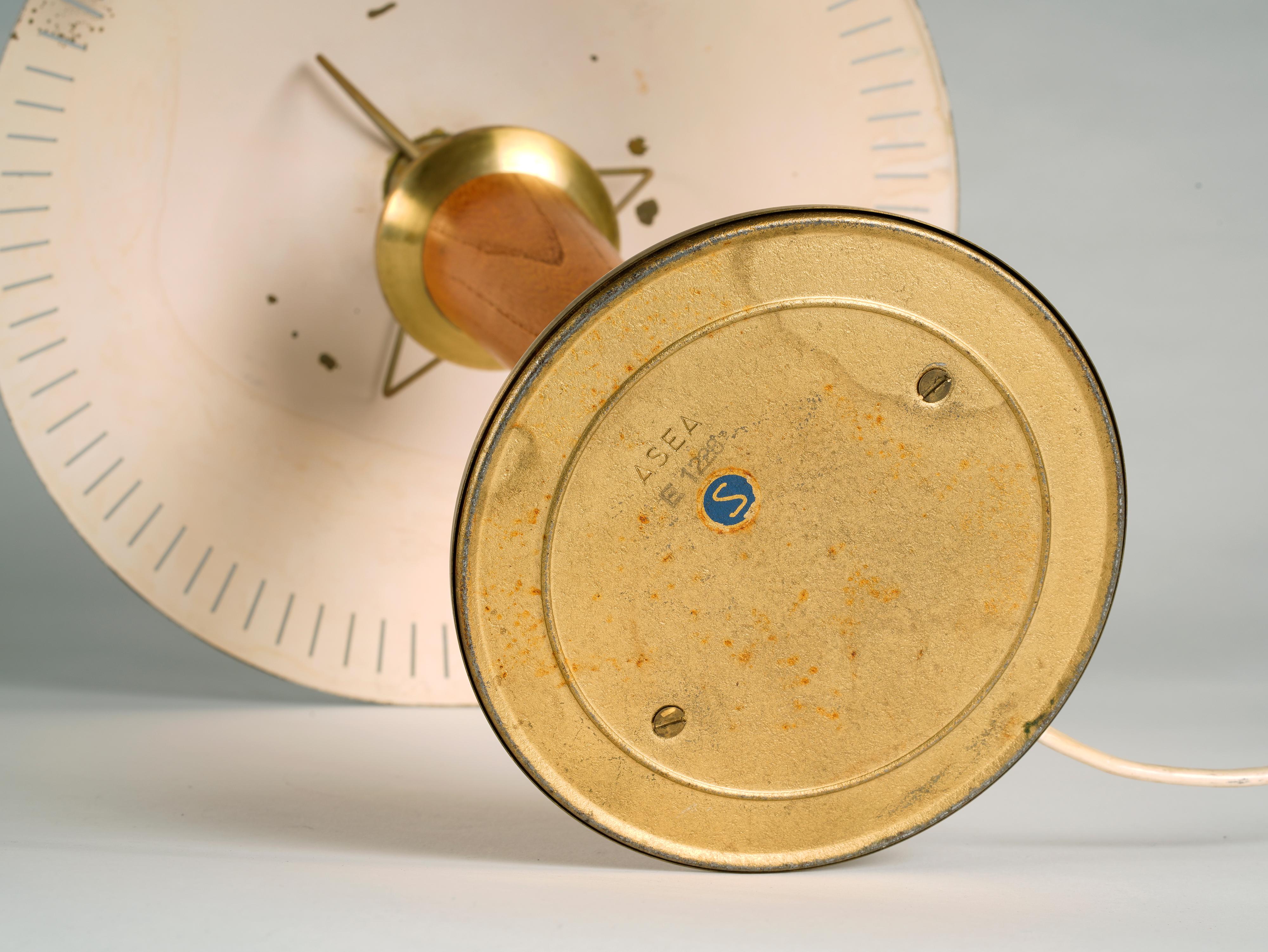 Mid-20th Century Swedish designer, ASEA desk lamp in brass and stained elm, 1940s For Sale