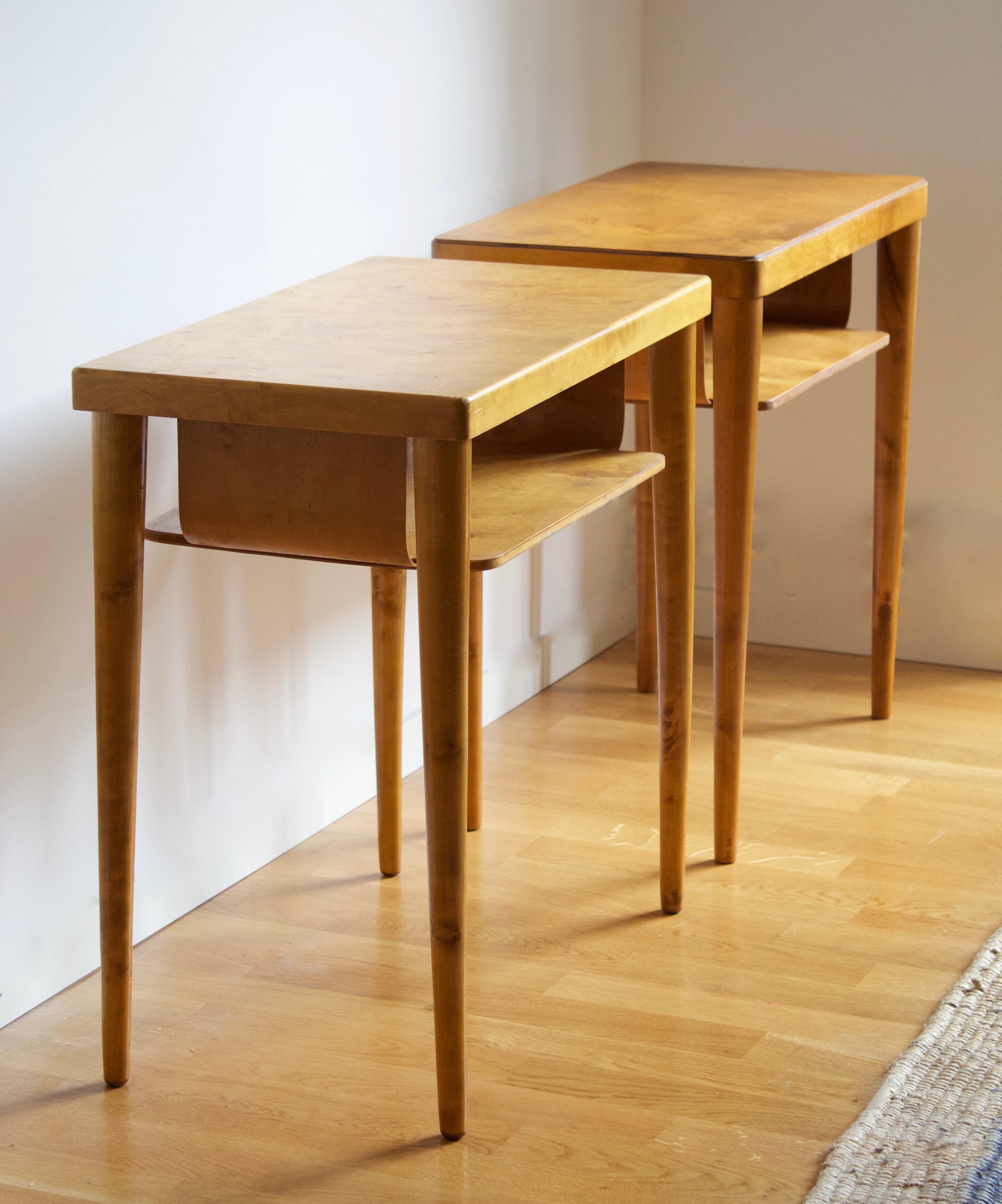 A set of bedside cabinets / tables / nightstands. Designed and produced in Sweden, 1940s. In lacquered birch. 

Other designers working in similar style and materials include Axel Einar Hjorth, Roland Wilhelmsson, Pierre Chapo, and Charlotte
