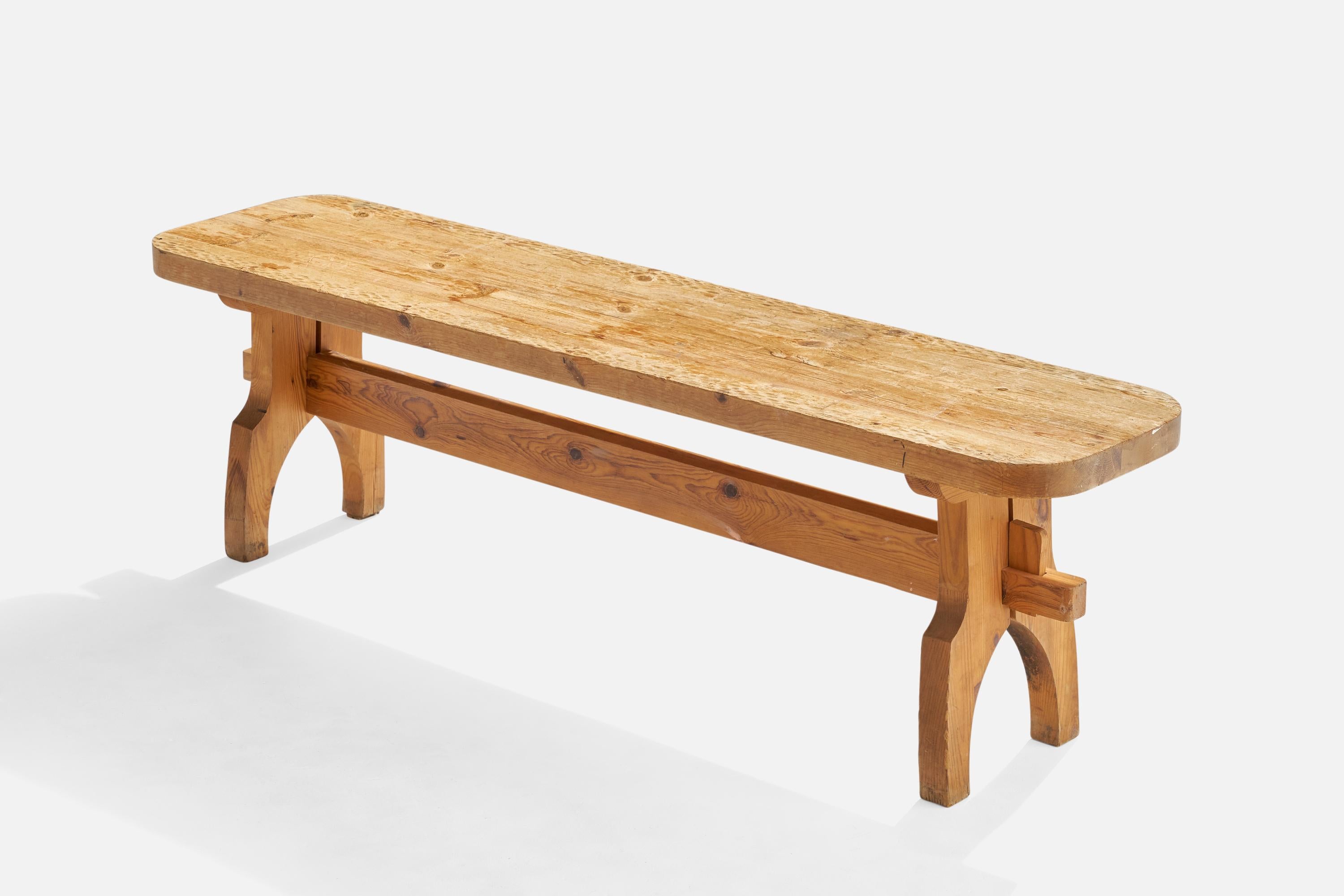A pine bench with hand-carved details designed and produced in Sweden, c. 1960s.