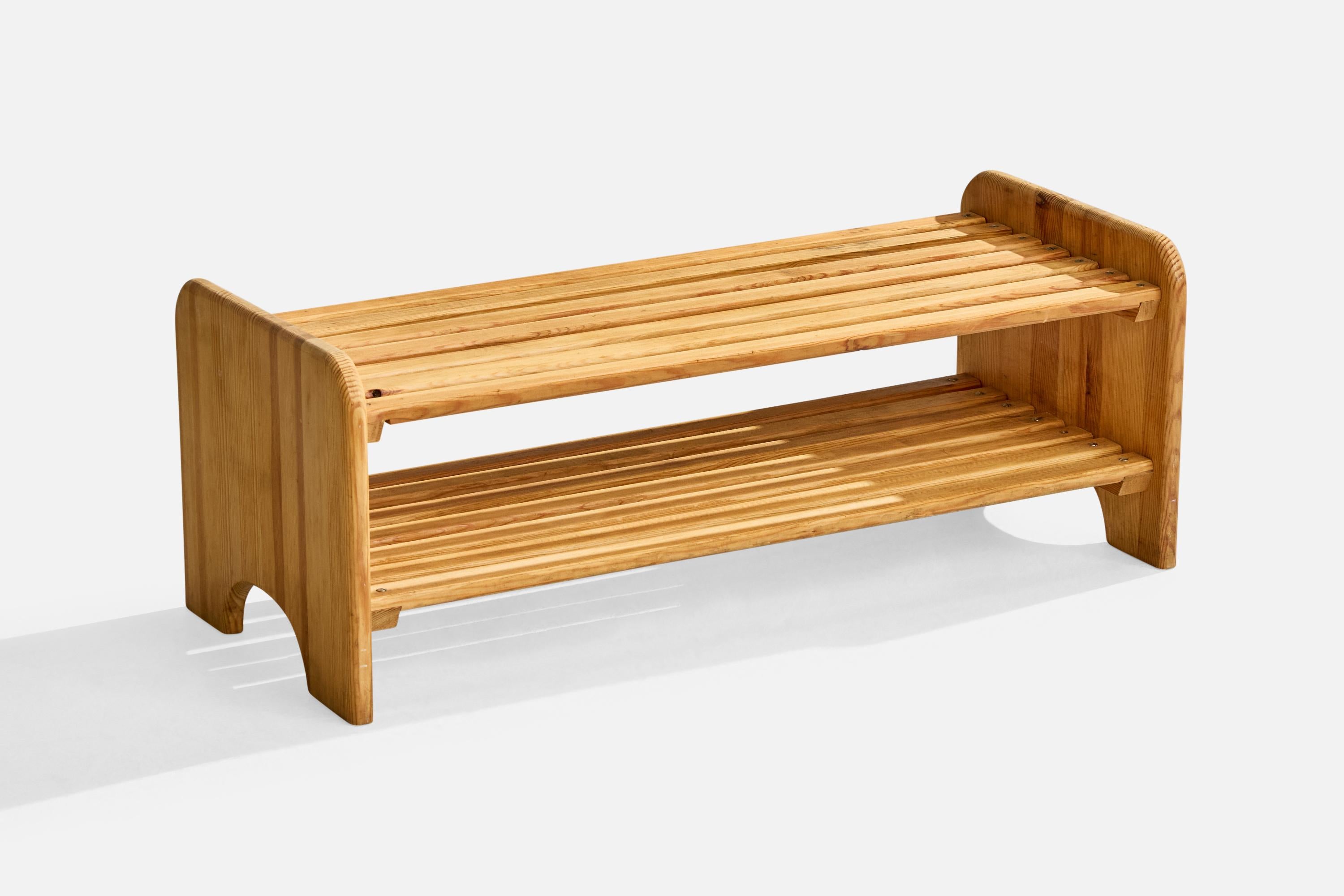 A low pine bench with shoe rack designed and produced in Sweden, c. 1970s.

Wear consistent with age and use

Overall Dimensions (inches): 11.5