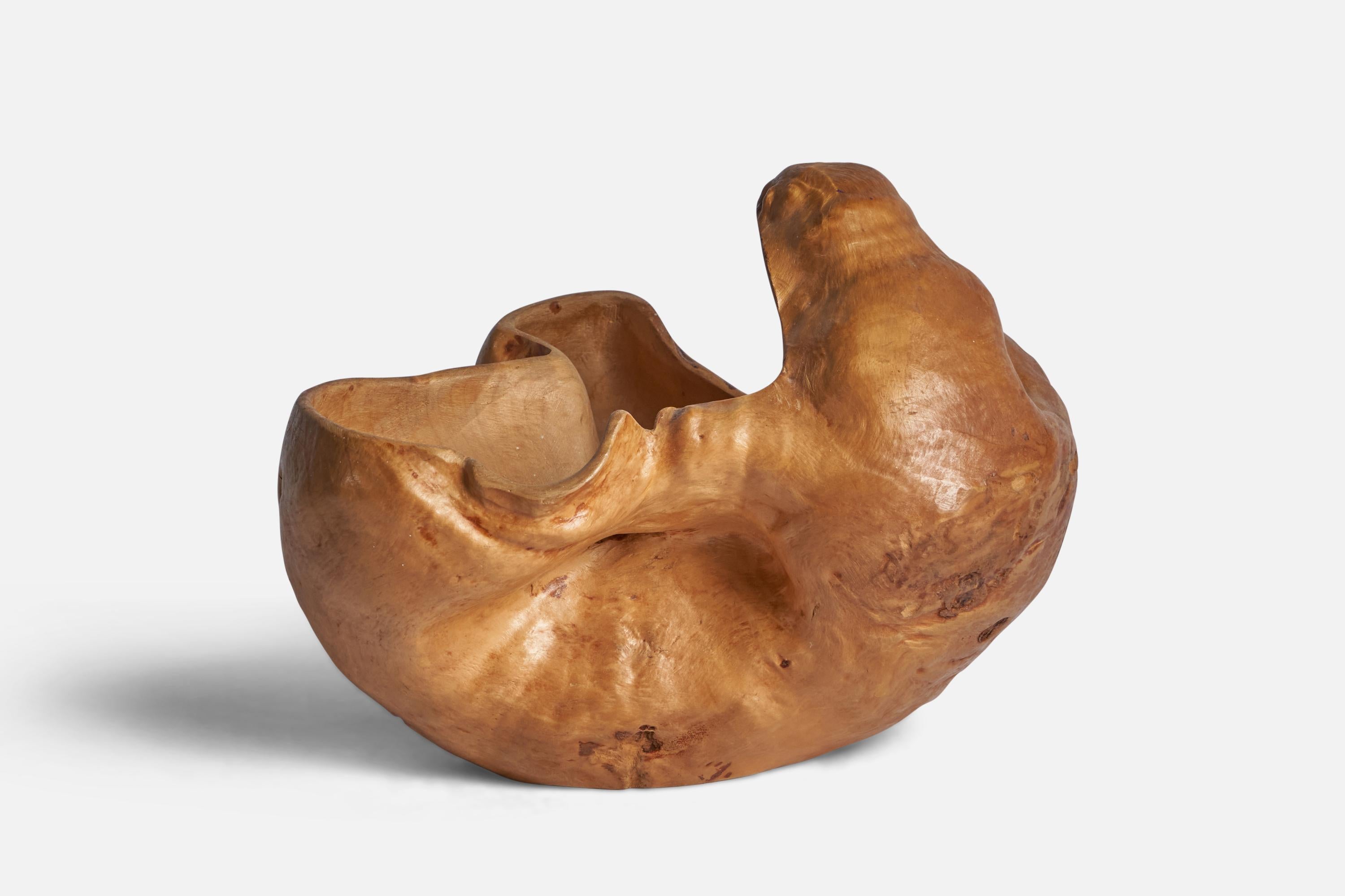 A burl wood bowl designed and produced in Sweden, 1975.