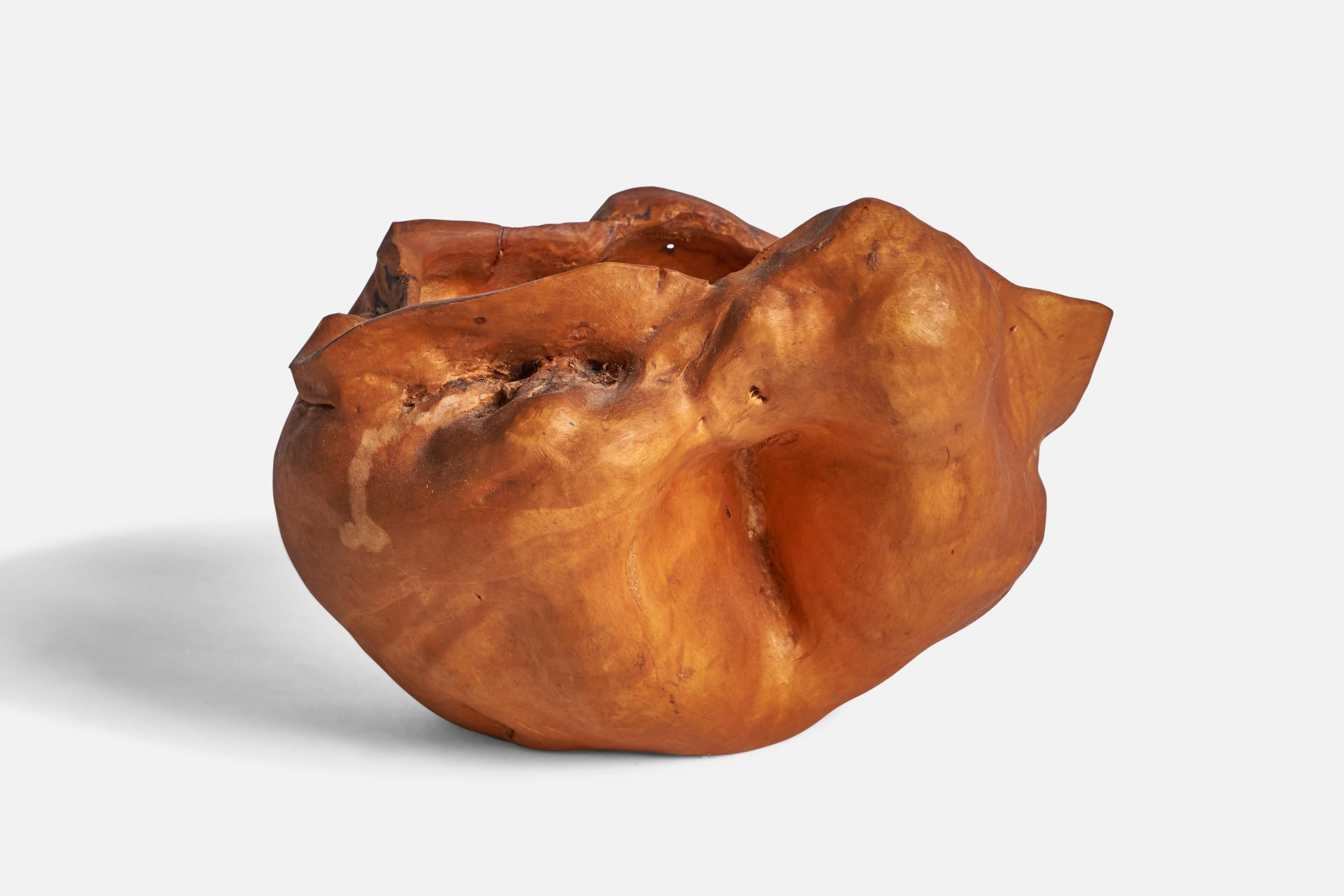 A burl wood bowl designed and produced in Sweden, 1983.