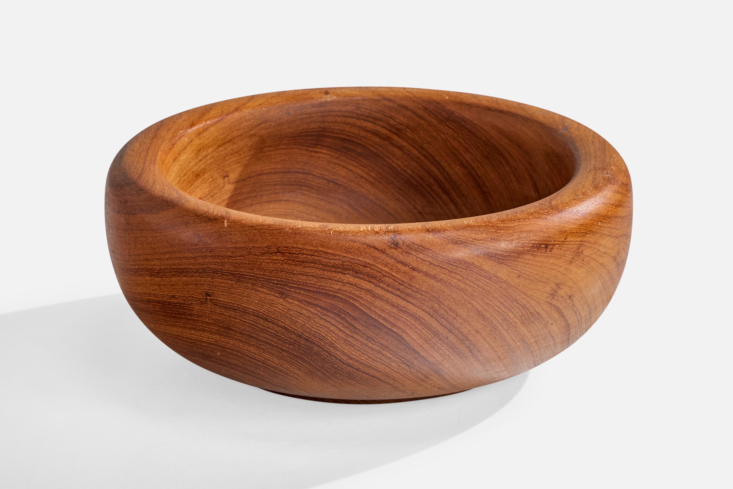 A teak bowl designed and produced in Sweden, c. 1950s.

Light scratching present to wood

Wear consistent with age and use

Overall Dimensions (inches): 4.0