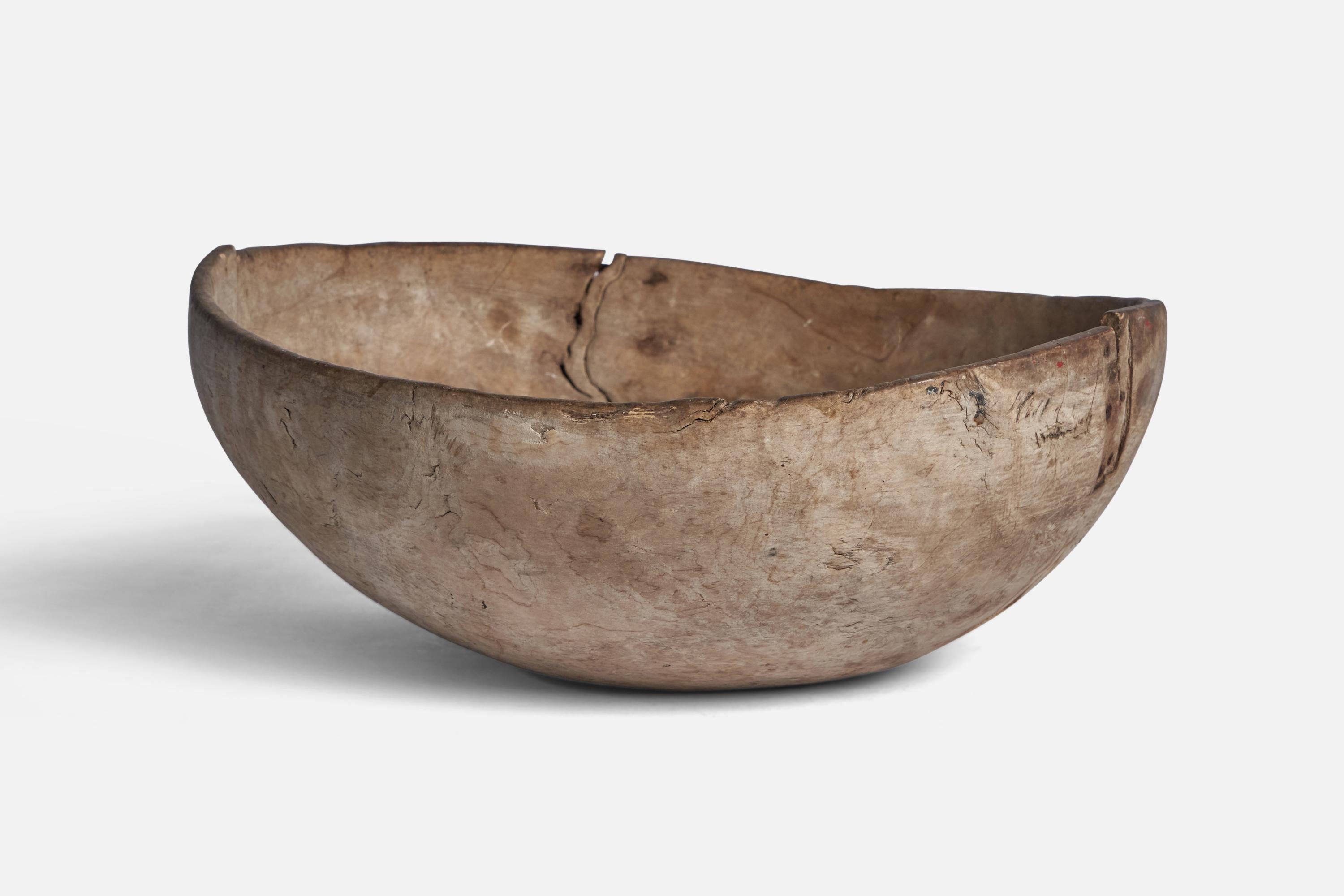 A wood bowl with metal repair produced in Sweden, 1782.