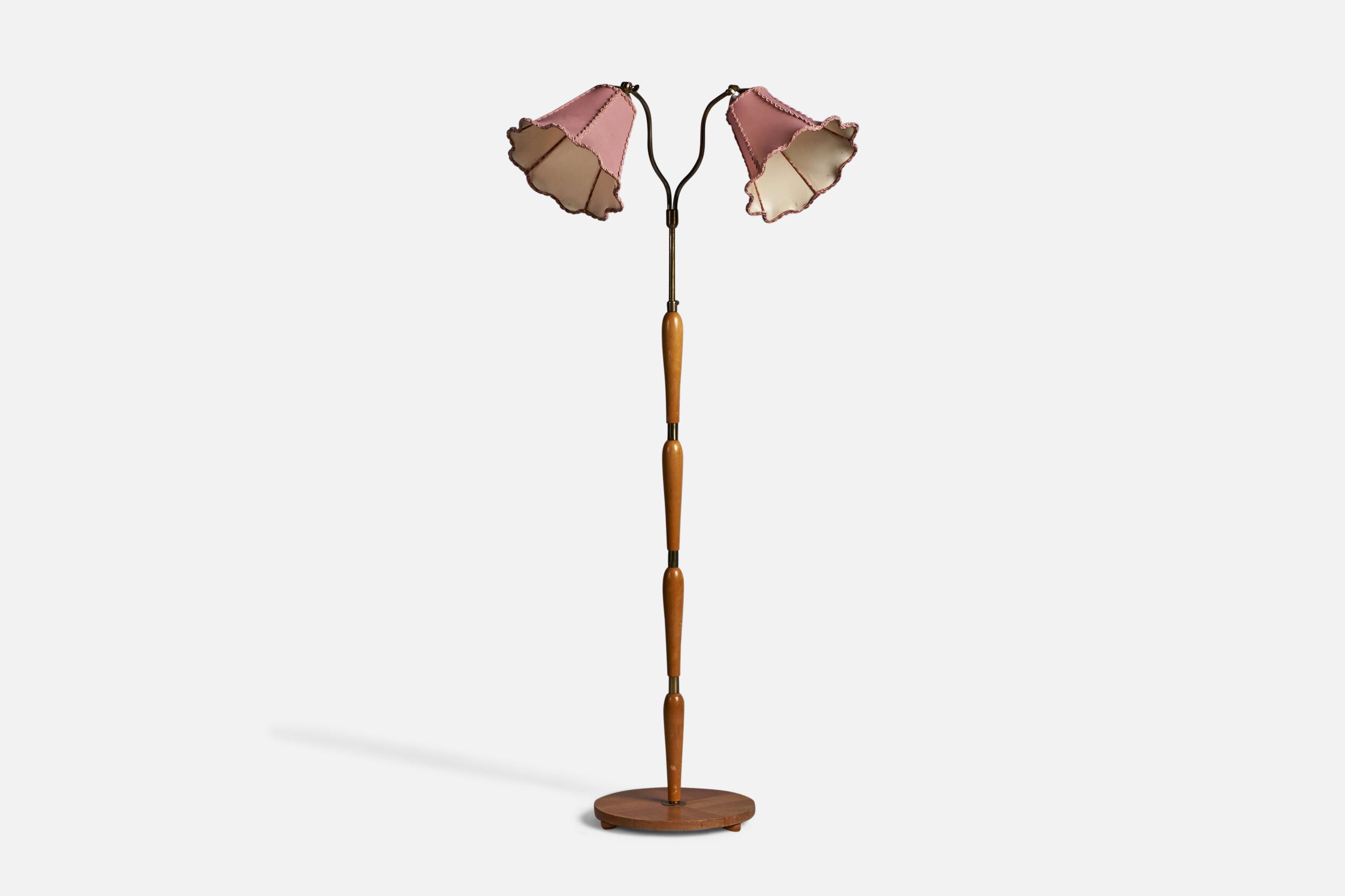 A two-armed elm, brass and pink fabric floor lamp, designed and produced in Sweden, 1930s.

Overall Dimensions (inches): 59.5