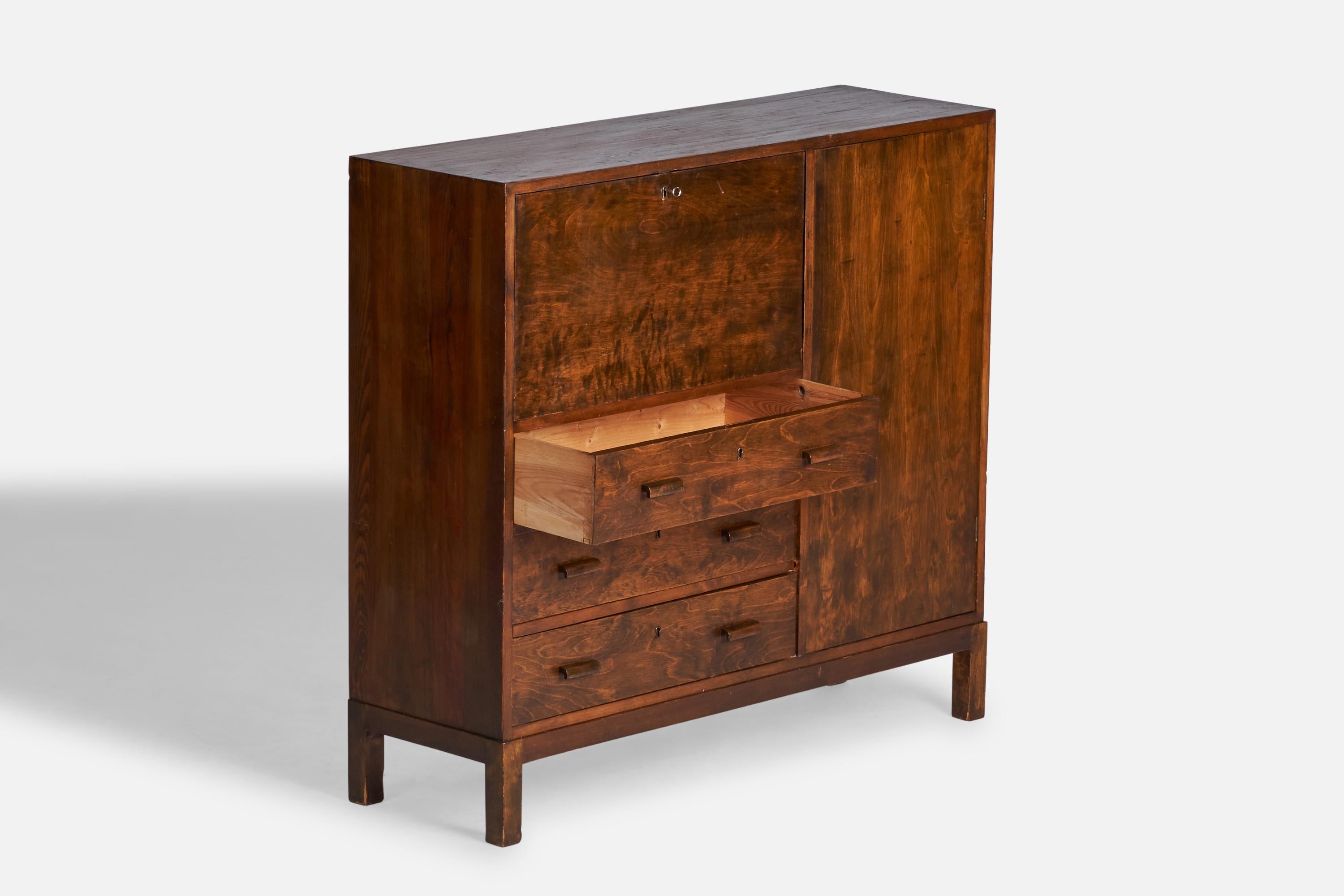 A dark-stained birch cabinet designed and produced in Sweden, 1930s.