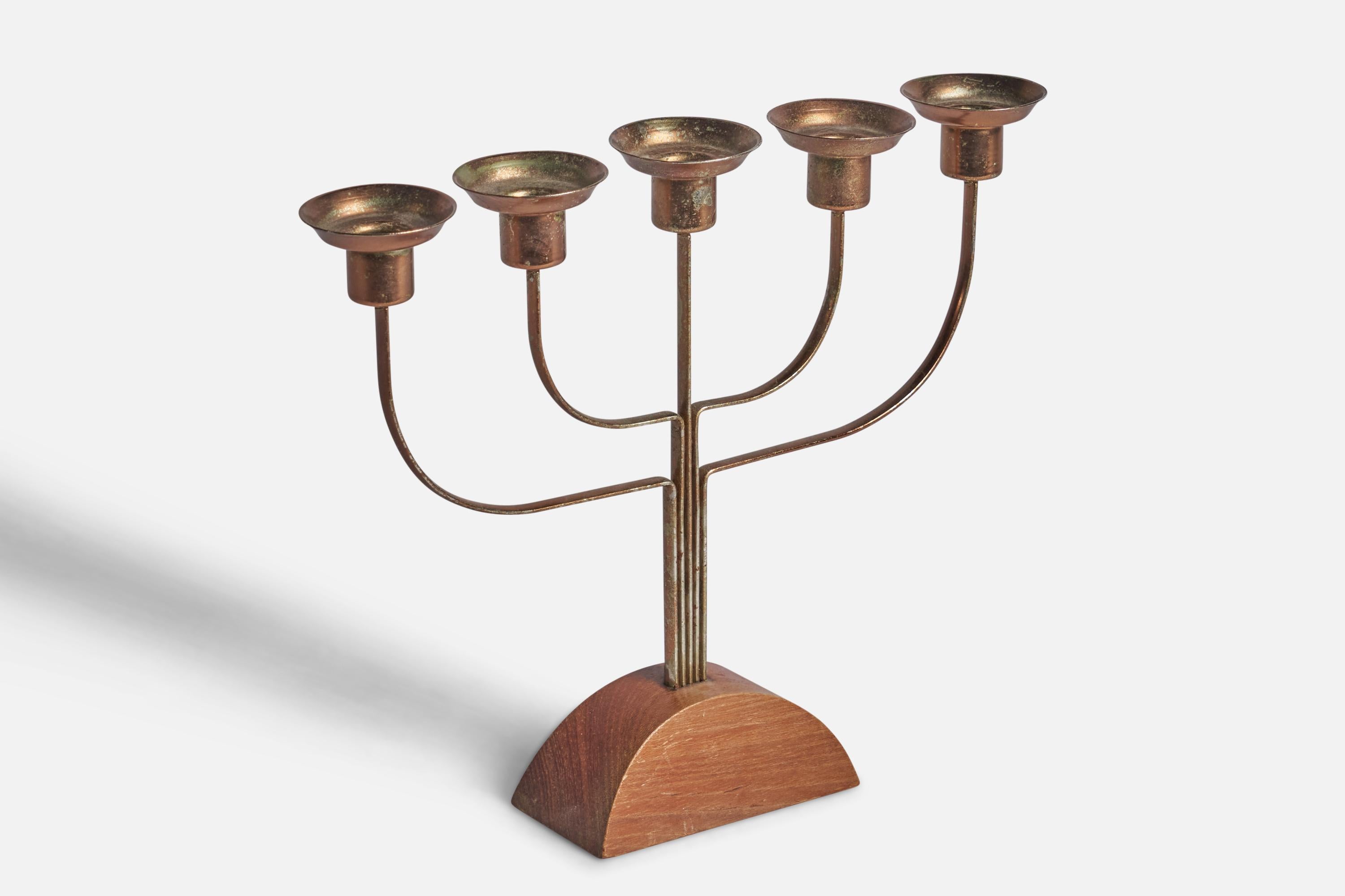 A brass and elm candelabra designed and produced in Sweden, c. 1940s.

fits 0.8” diameter candles
