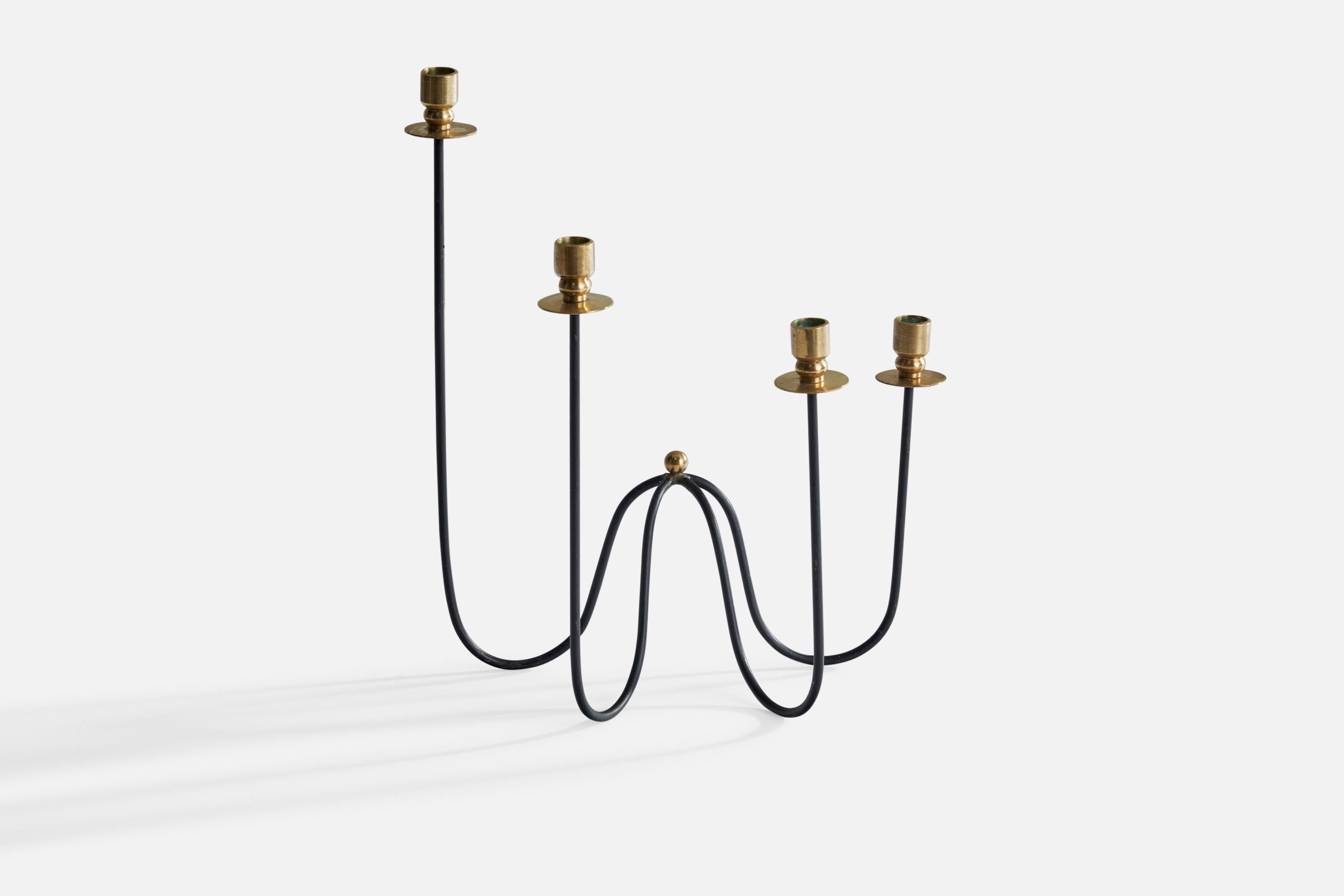 A small brass and black-painted metal candelabra designed and produced in Sweden, 1940s.

Holds .4” diameter candles.