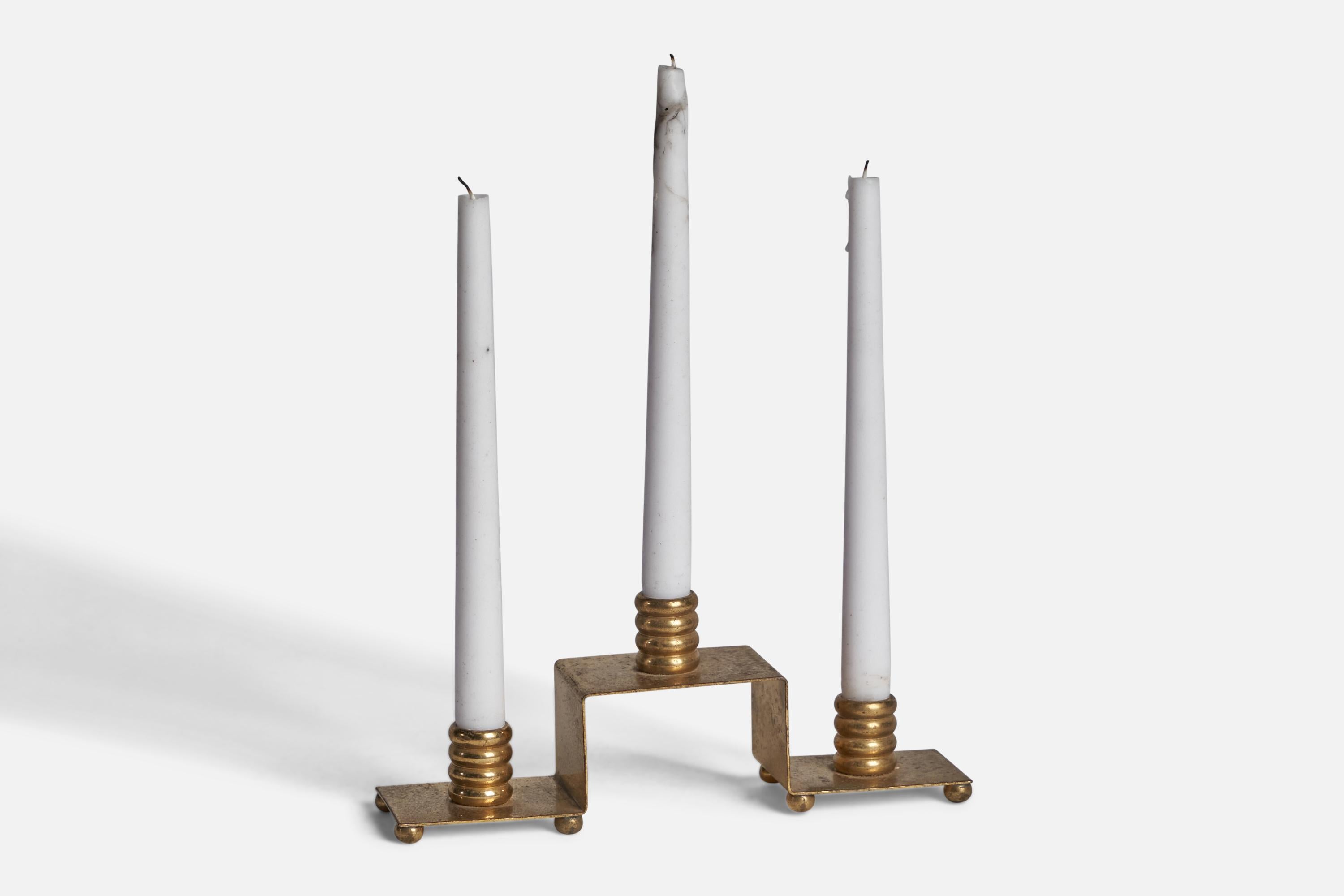 A brass candelabra designed and produced in Sweden, 1940s.

Fits 0.75” diameter candles