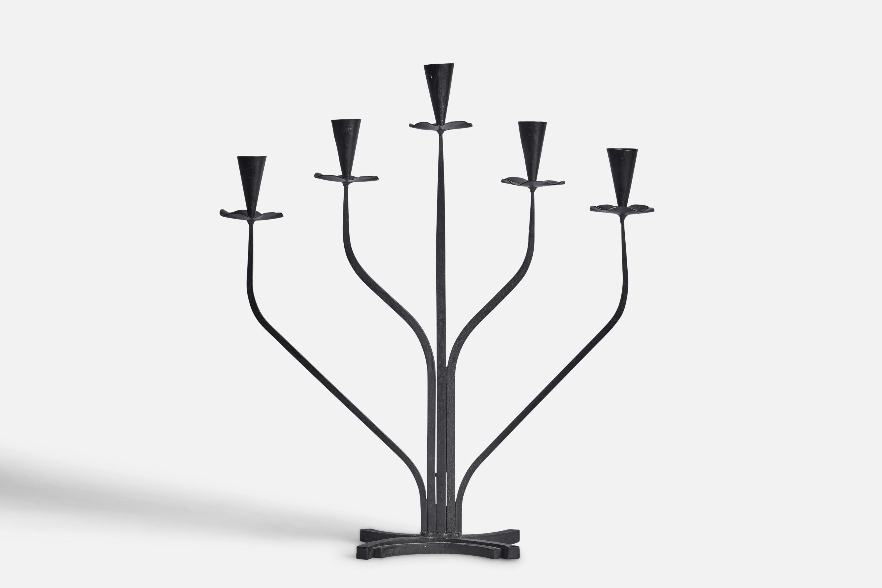 A black-painted iron candelabra designed and produced in Sweden, 1940s.

Fits 0.80” diameter candles