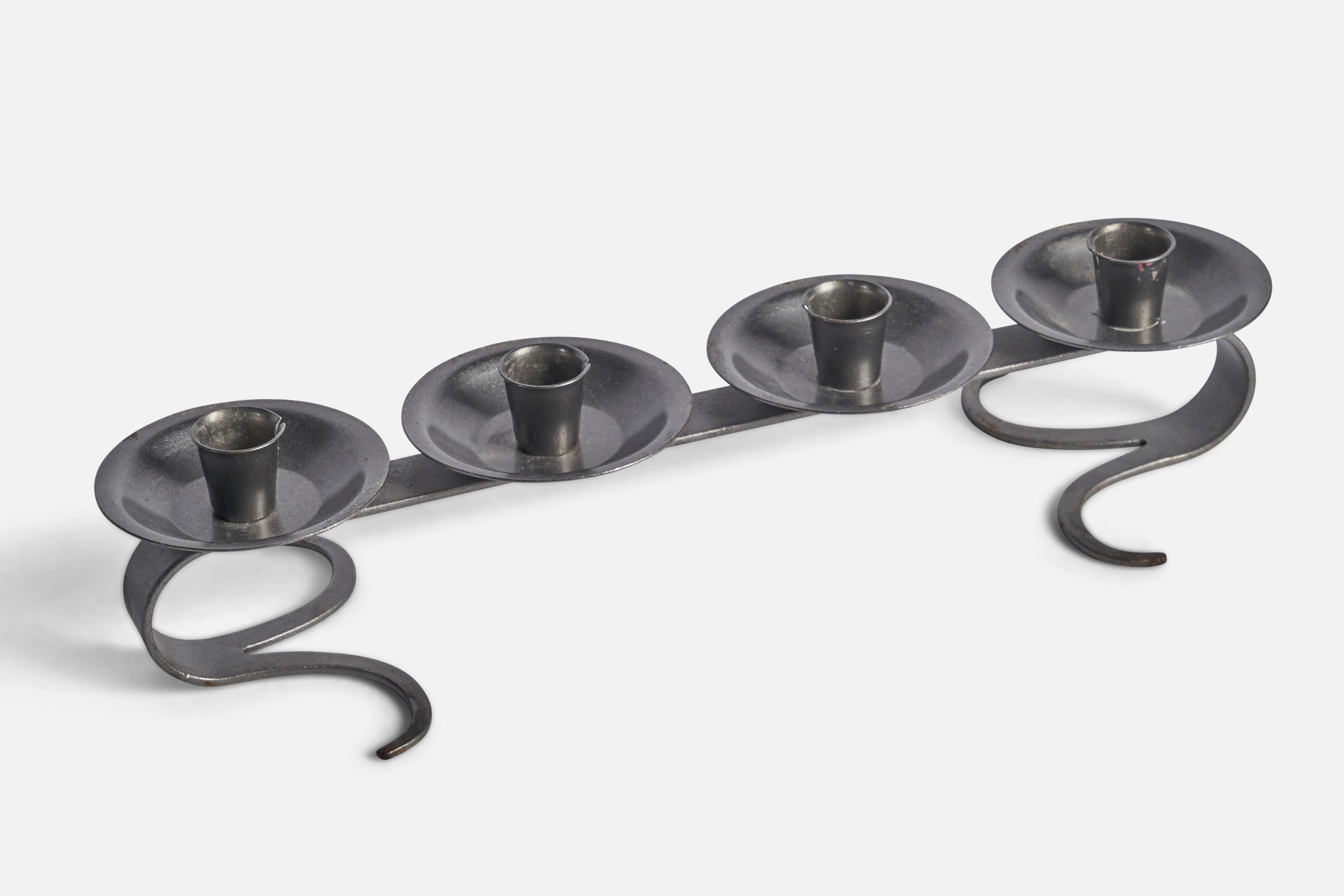 An iron candelabra designed and produced in Sweden, c. 1960s.

Holds 0.85” candles