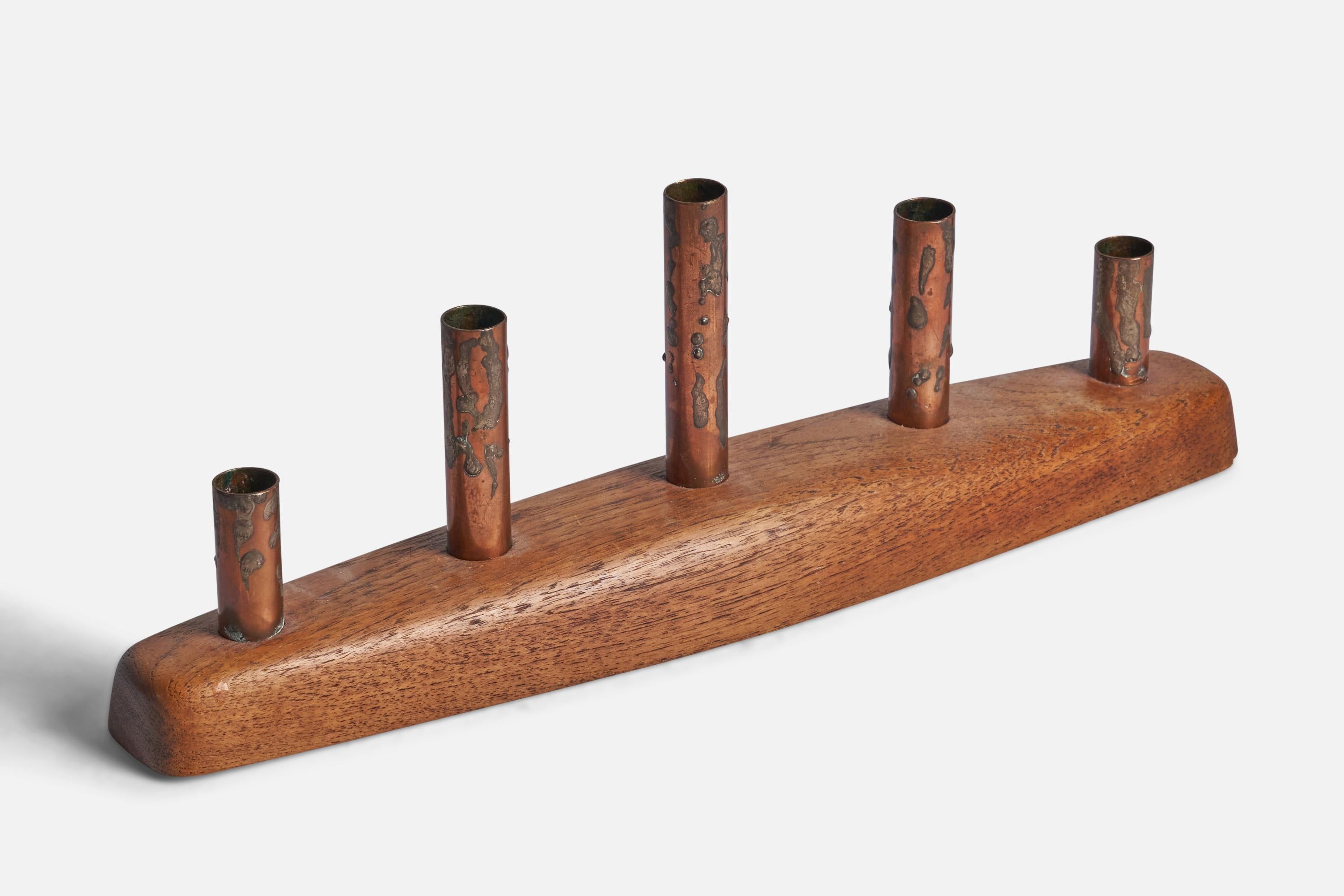 A teak, copper and tin candelabra designed and produced in Sweden, c. 1950s.

Fits 0.75” diameter candles