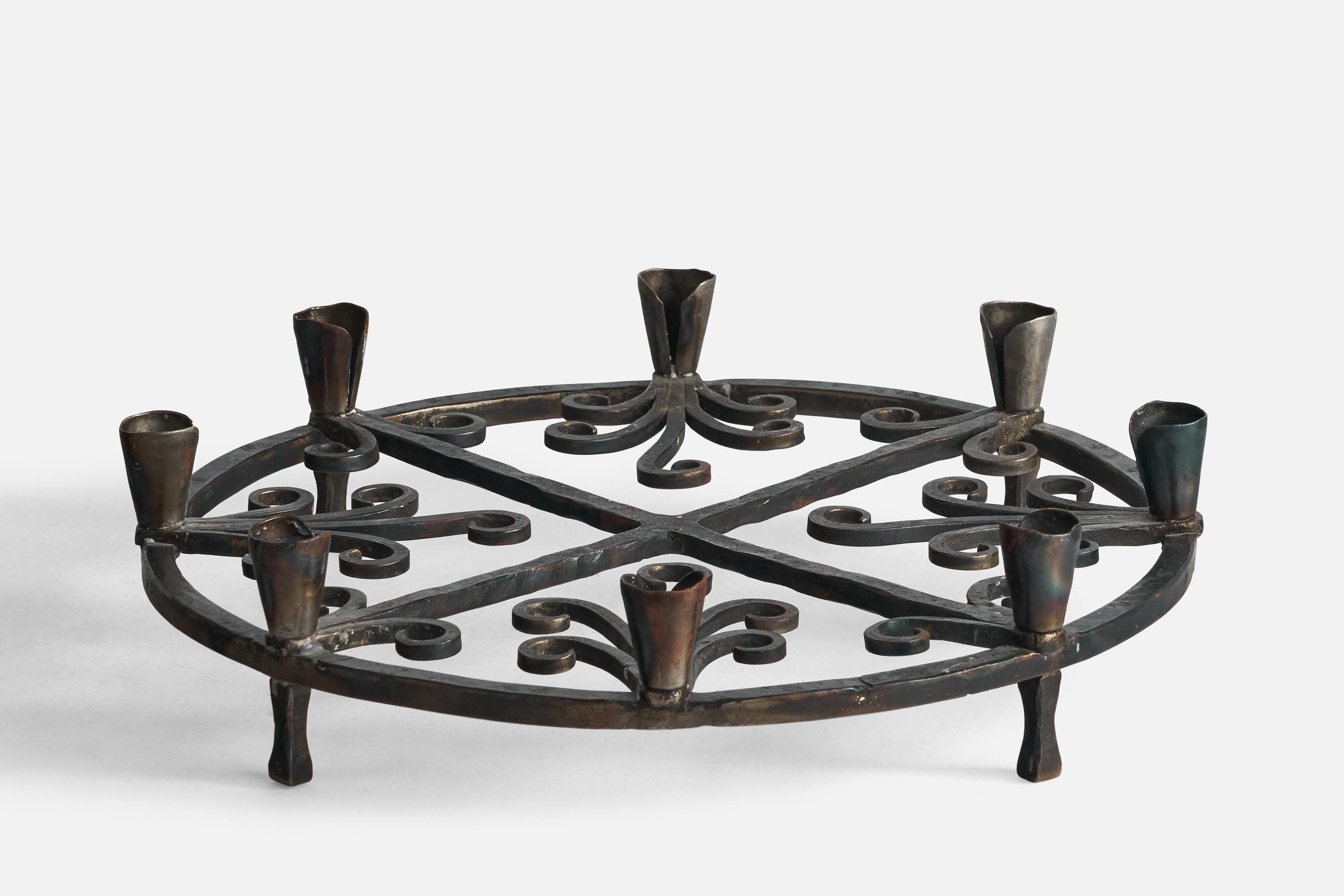 A wrought iron candelabra designed and produced in Sweden, c. 1940s.

Holds eight 0.6” diameter candles